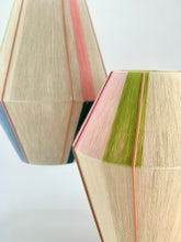Load image into Gallery viewer, Cluster of two handwoven pendant lights with geometric shapes, featuring natural cotton linen, lime green, pale pink, salmon pink, and blue cotton yarn and a pink exposed metal frame-product photo on white background
