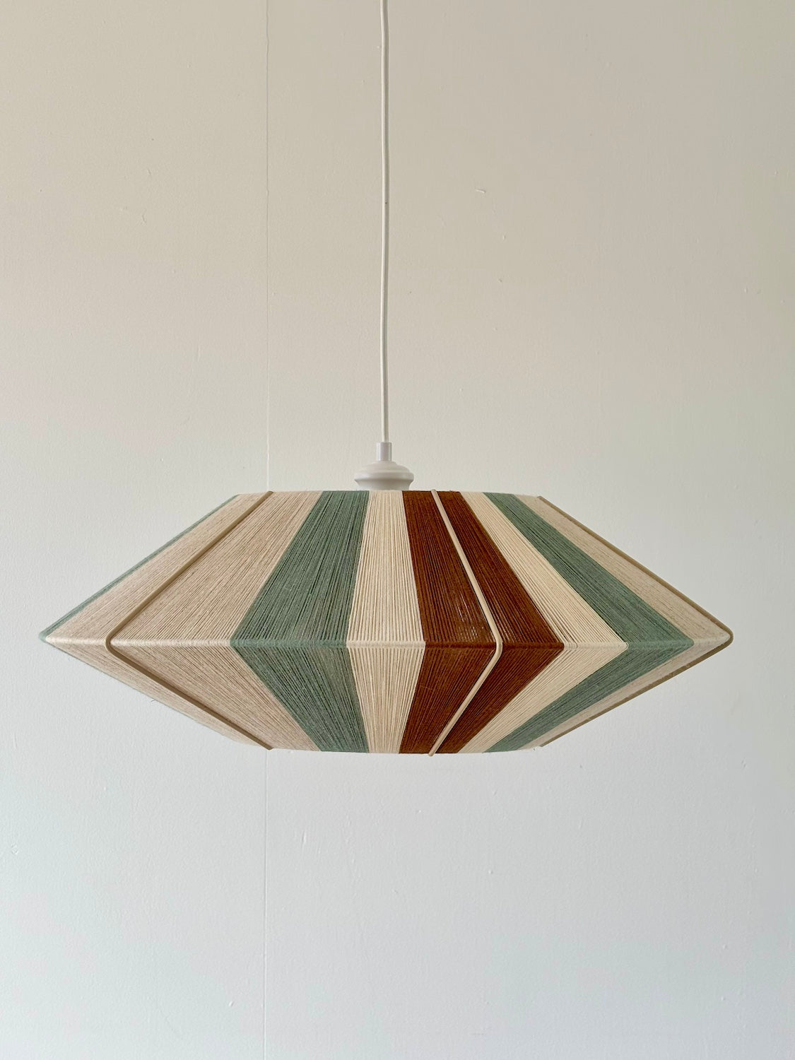 Sarto Orb pendant light with geometric handwoven panels in sage, natural and fawn yarn