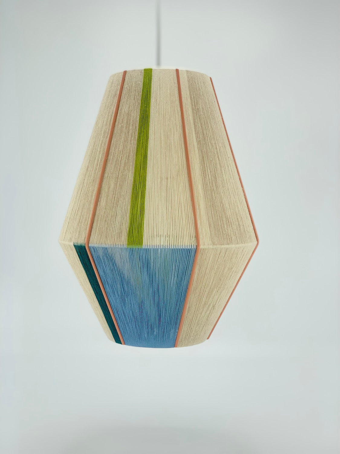 Alice Baya pendant light in blue, green, lime and natural yarns by Skye Lightly.