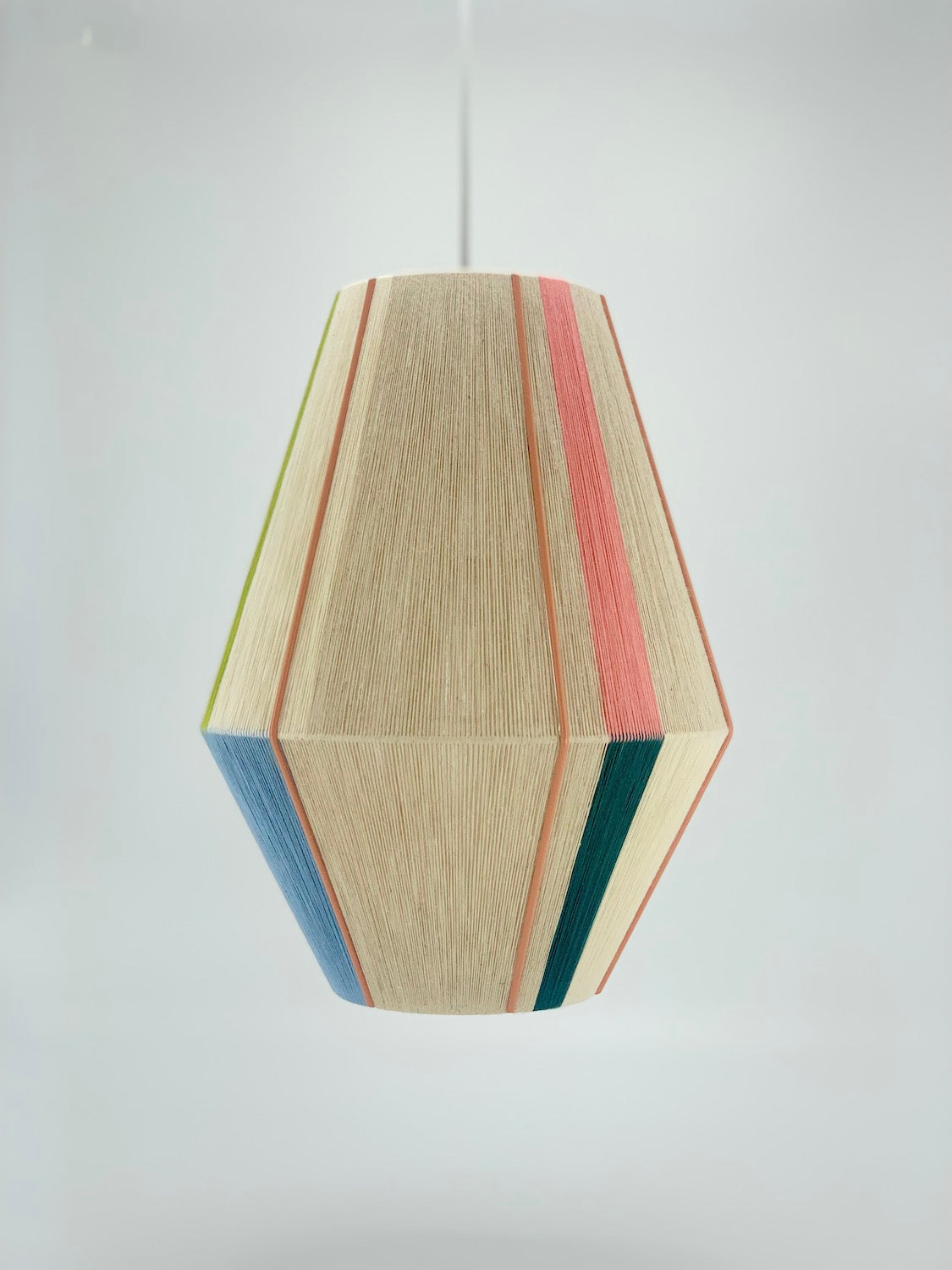 Alice Baya pendant light in salmon, blue, green, and natural yarns by Skye Lightly.