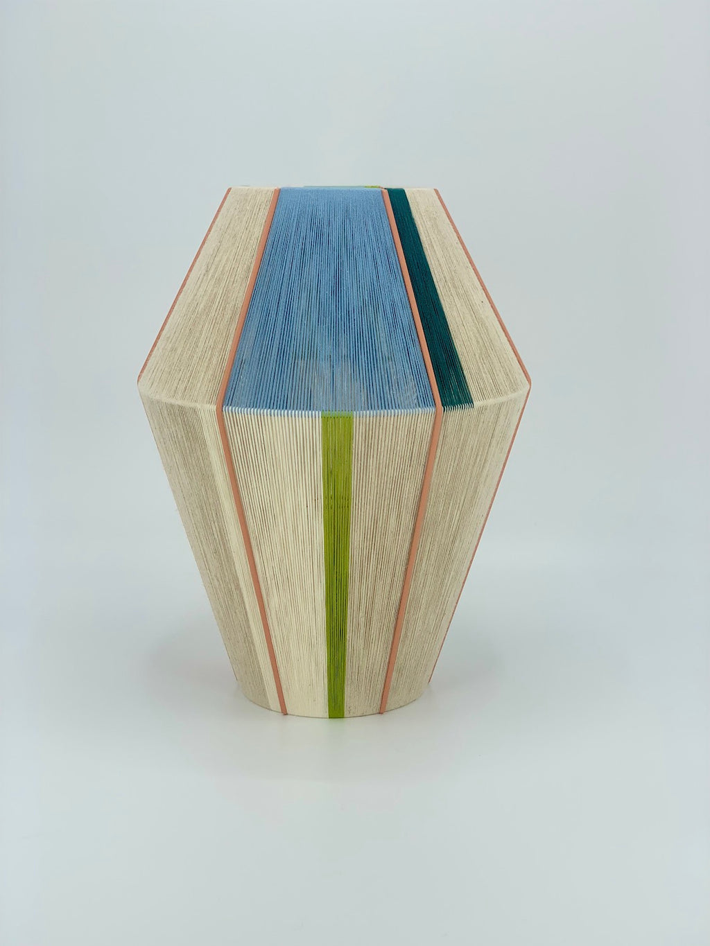 Alice Baya pendant light in salmon, blue, lime, green and natural yarns by Skye Lightly.
