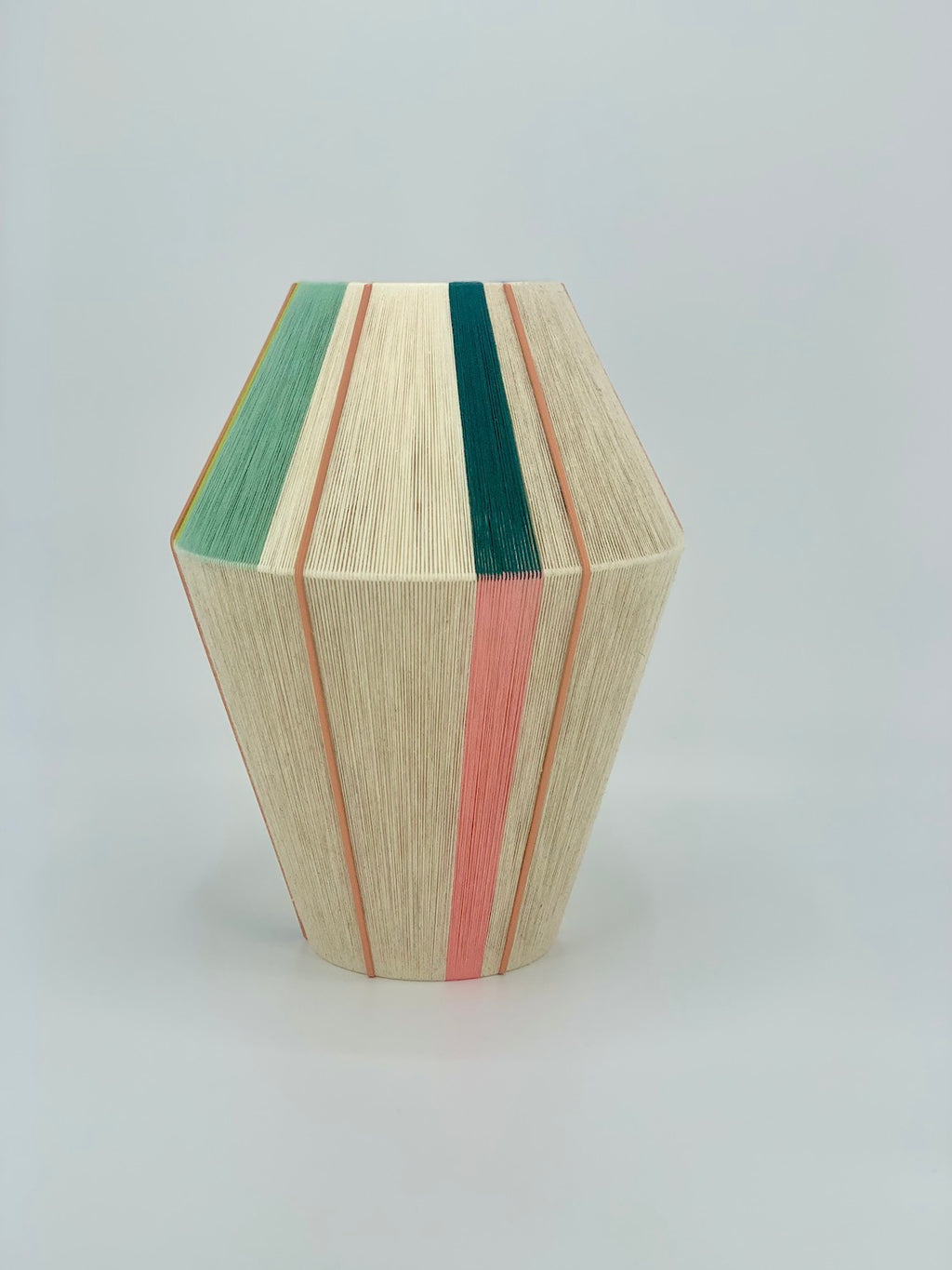 Alice Baya pendant light in salmon,  green, lime and natural yarns by Skye Lightly.
