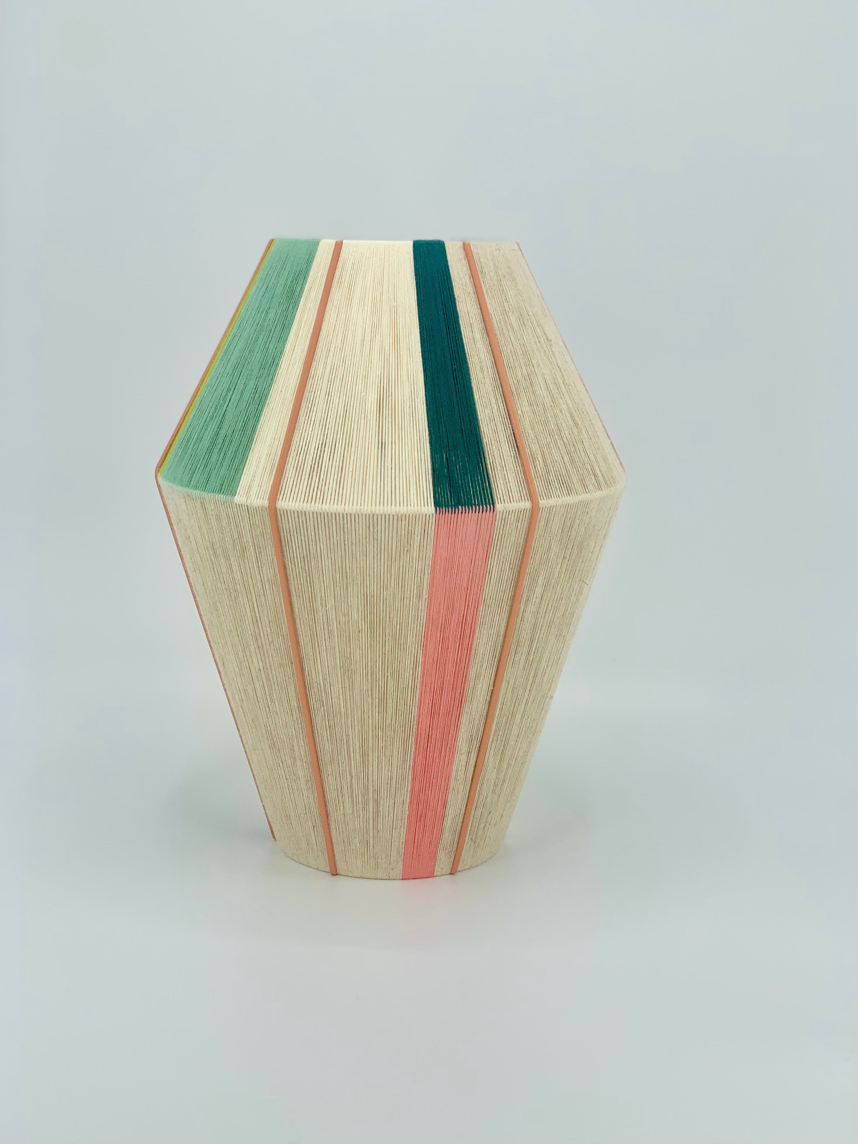 Alice Baya pendant light handwoven in salmon, blue, green, lime and natural yarns by Skye Lightly.
