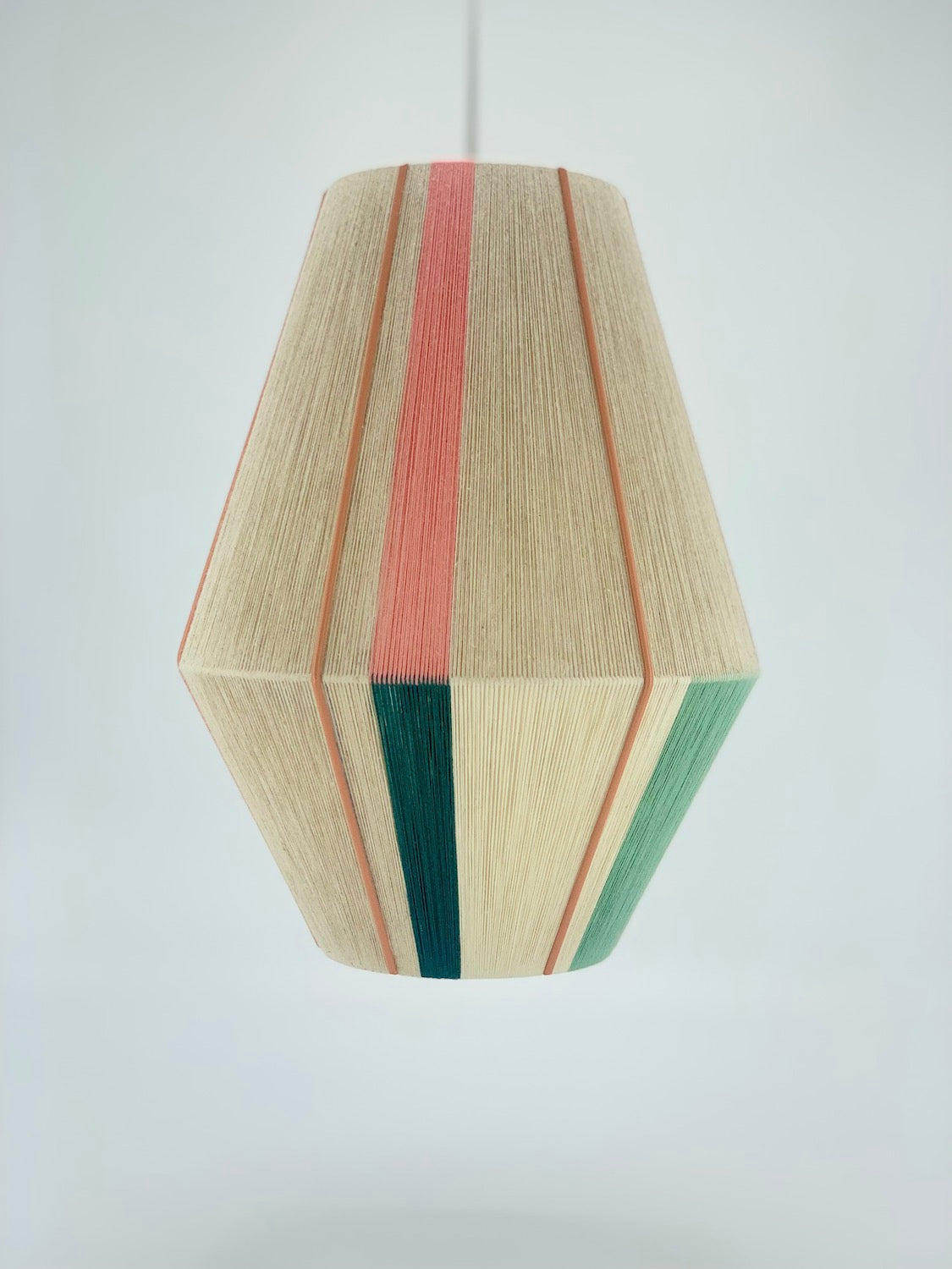 Alice Baya pendant light in salmon, blue, green, lime and natural yarns by Skye Lightly.