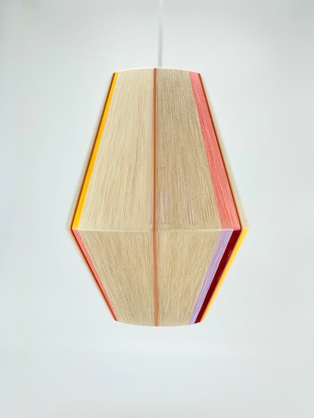 Caroline Baya pendant light in salmon, lavender, yellow, raspberry and natural yarns by Skye Lightly