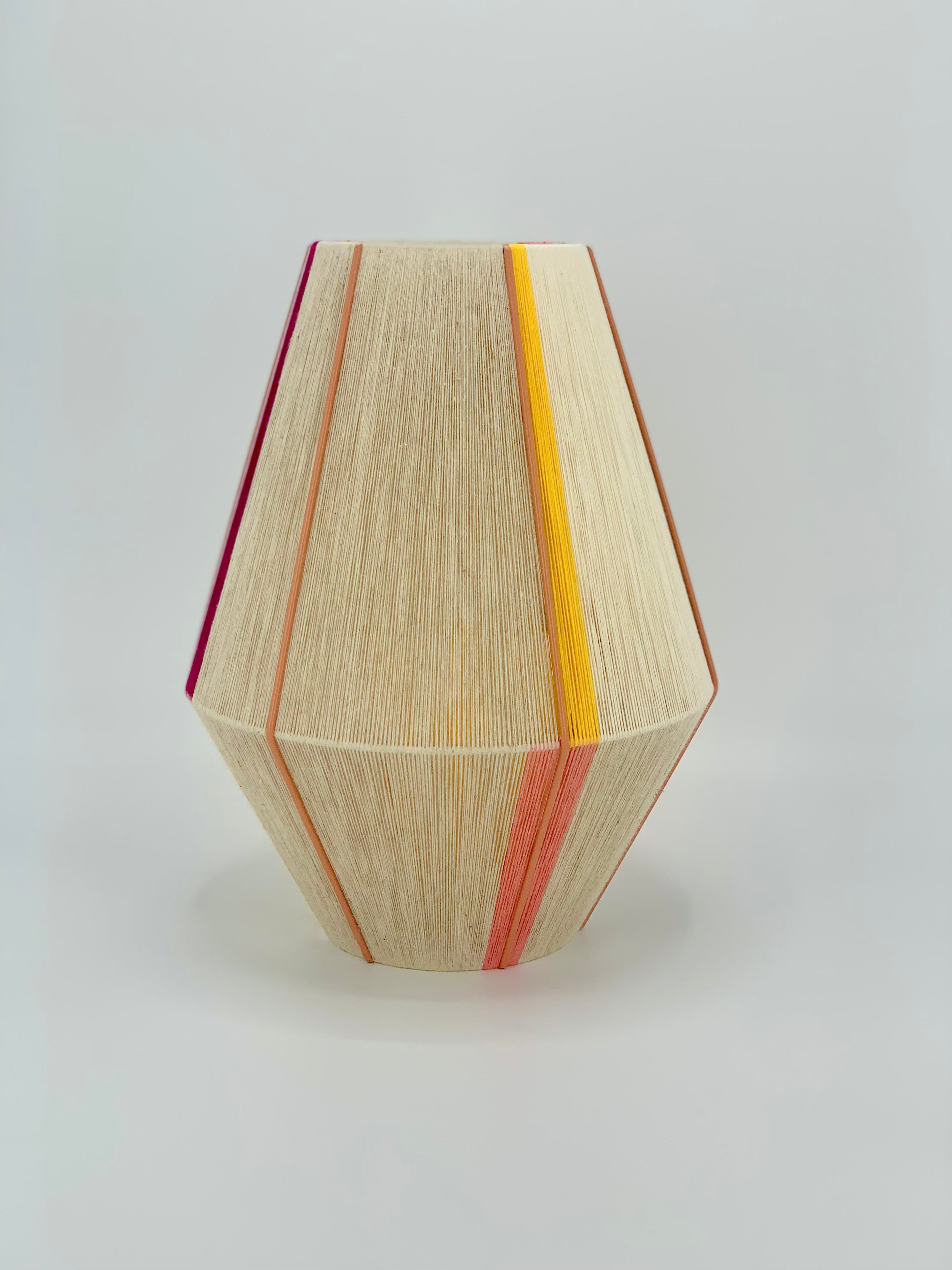 Caroline Baya pendant light handwoven in salmon, yellow, raspberry and natural yarns by Skye Lightly.