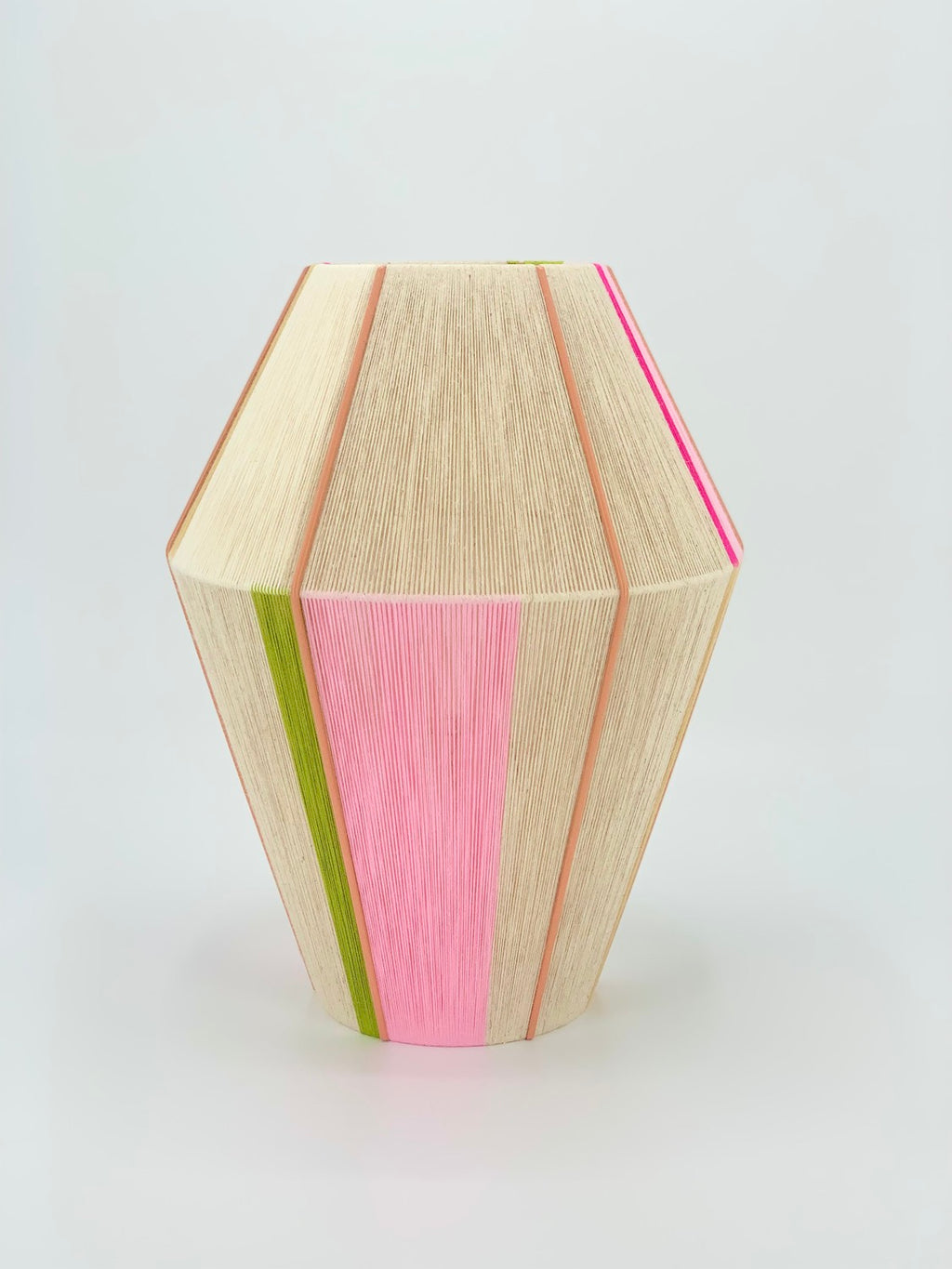 Lana Baya pendant light handwoven in bright pink, rose, and natural yarns by Skye Lightly