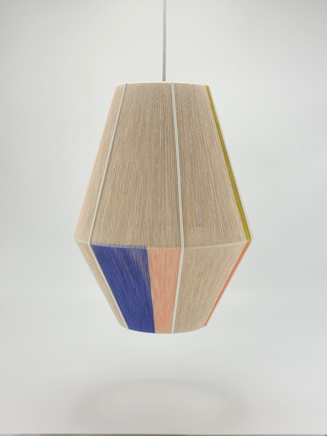 bottom view of Parker Baya pendant light handwoven in mustard, orange, peach and periwinkle yarns by Skye Lightly