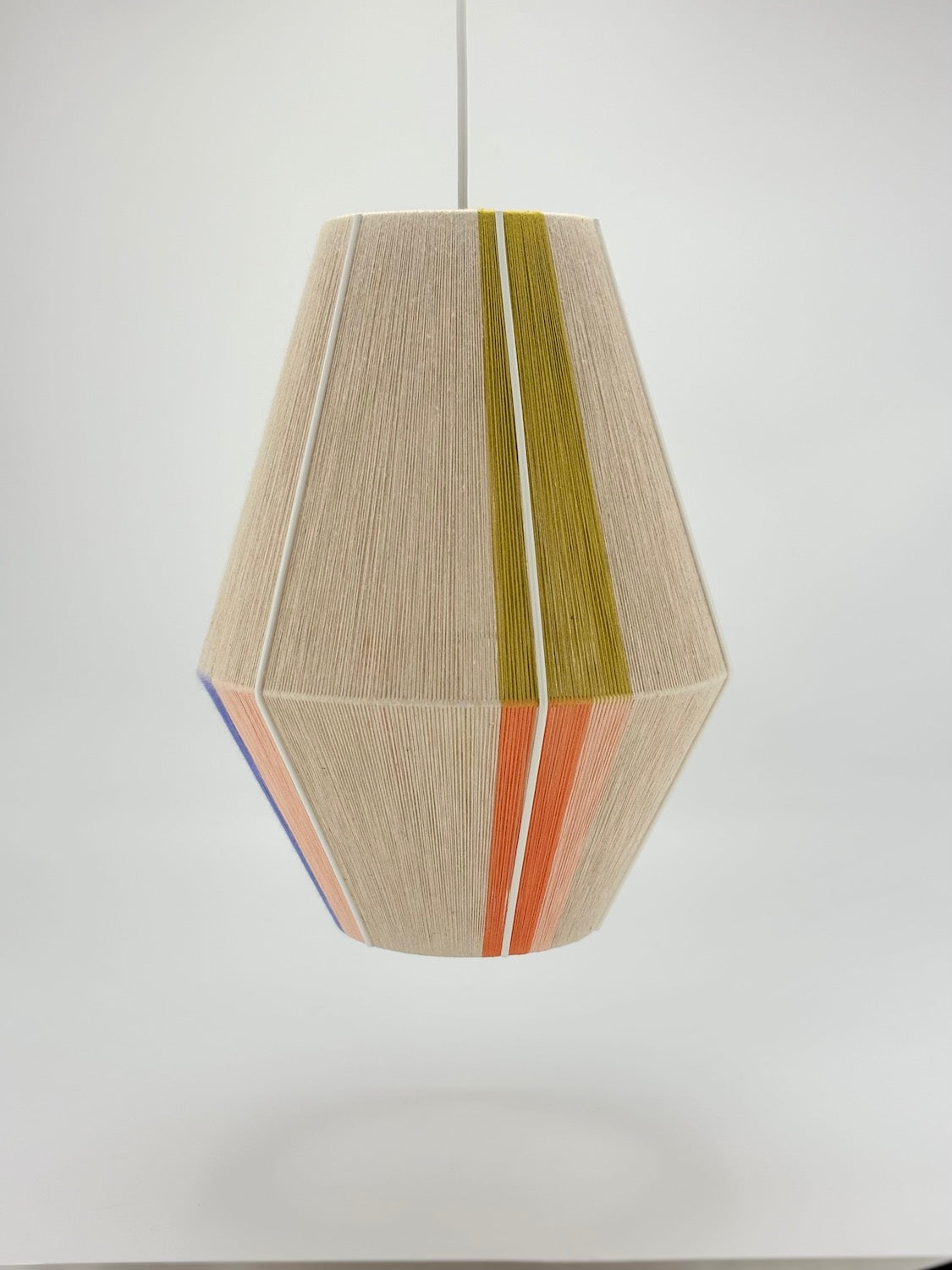middle view of Parker Baya pendant light handwoven in mustard, orange, peach and periwinkle yarns by Skye Lightly