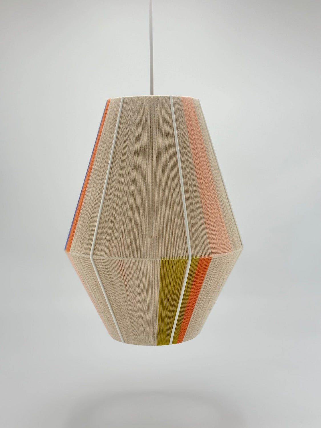 Parker Baya pendant light handwoven in mustard, orange, peach yarns by Skye Lightly