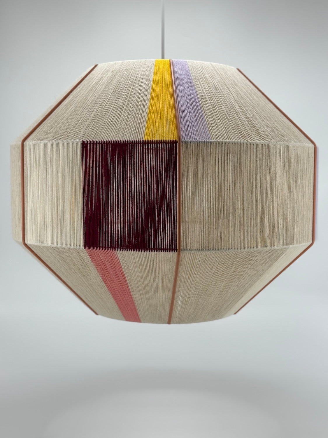 Bella Hive pendant light handwoven in salmon, lavender, buttercup yellow, raspberry and natural yarns by Skye Lightly