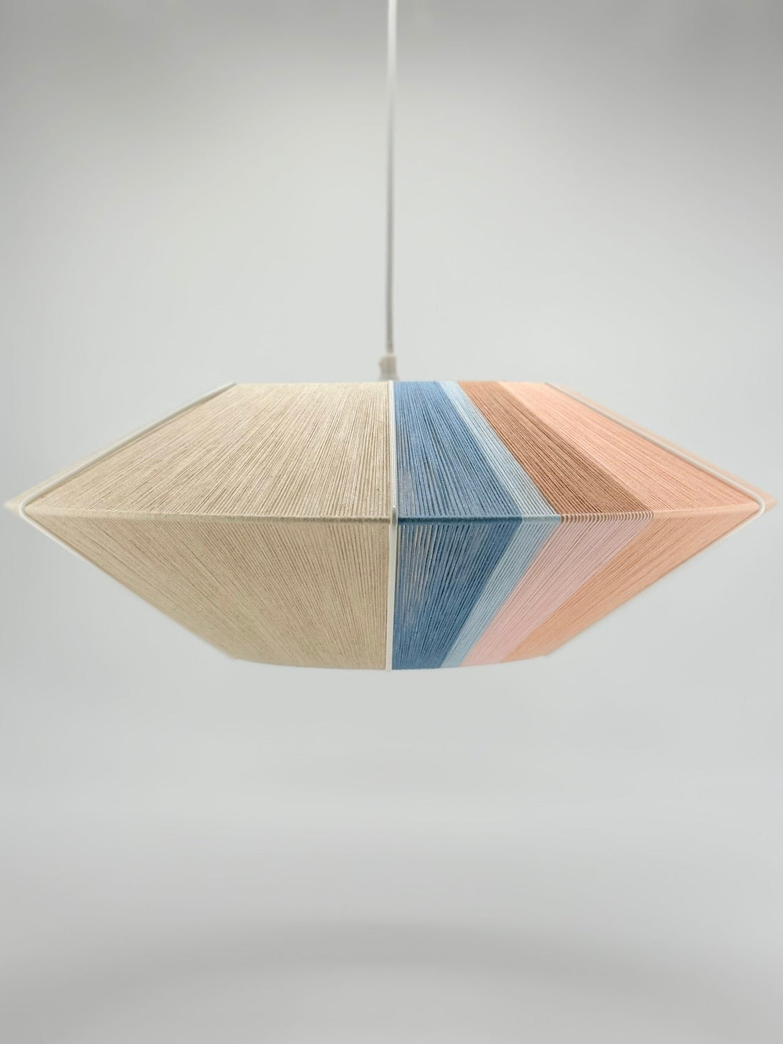 middle view of Jean Orb pendant light handwoven in cinnamon, peach, chambray, salmon, pale rose and natural yarns by Skye Lightly