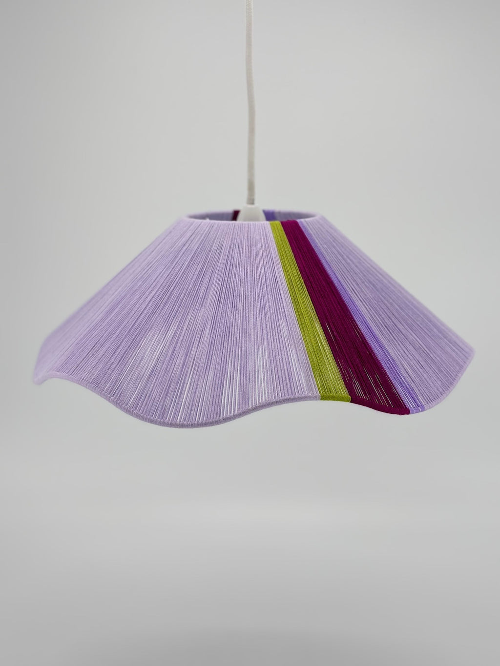 front view of iona Wave pendant light in lilac with green and raspberry stripes, handwoven by Skye Lightly.