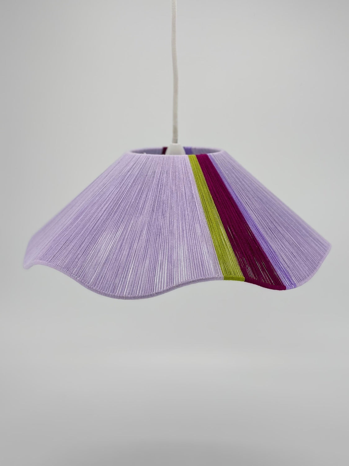 front view of iona Wave pendant light in lilac with green and raspberry stripes, handwoven by Skye Lightly.