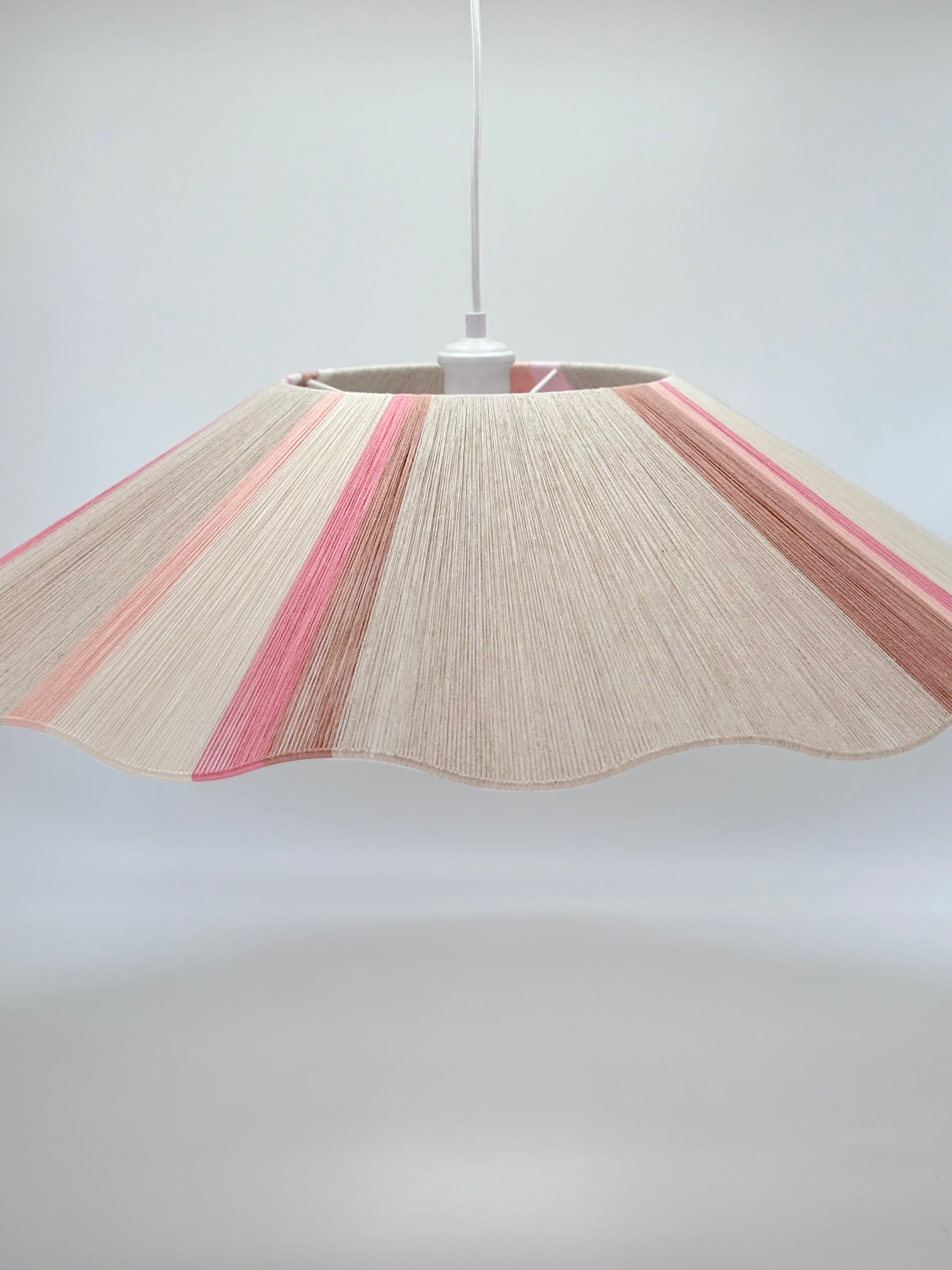 Handwoven Knox wave pendant light in soft pink and natural tones by Skye Lightly