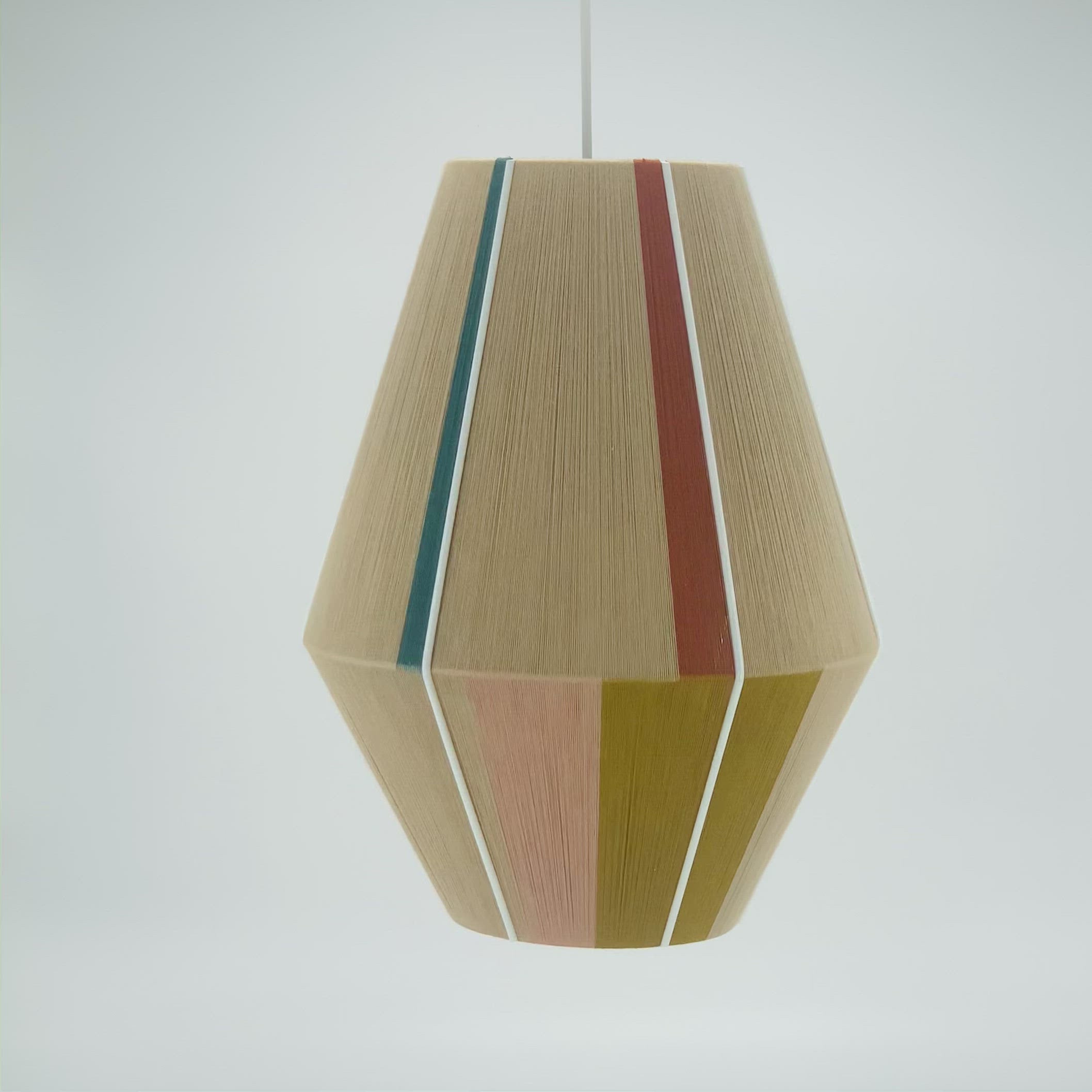 Casey Baya pendant light handwoven in periwinkle, blush, coral and natural yarns by Skye Lightly
