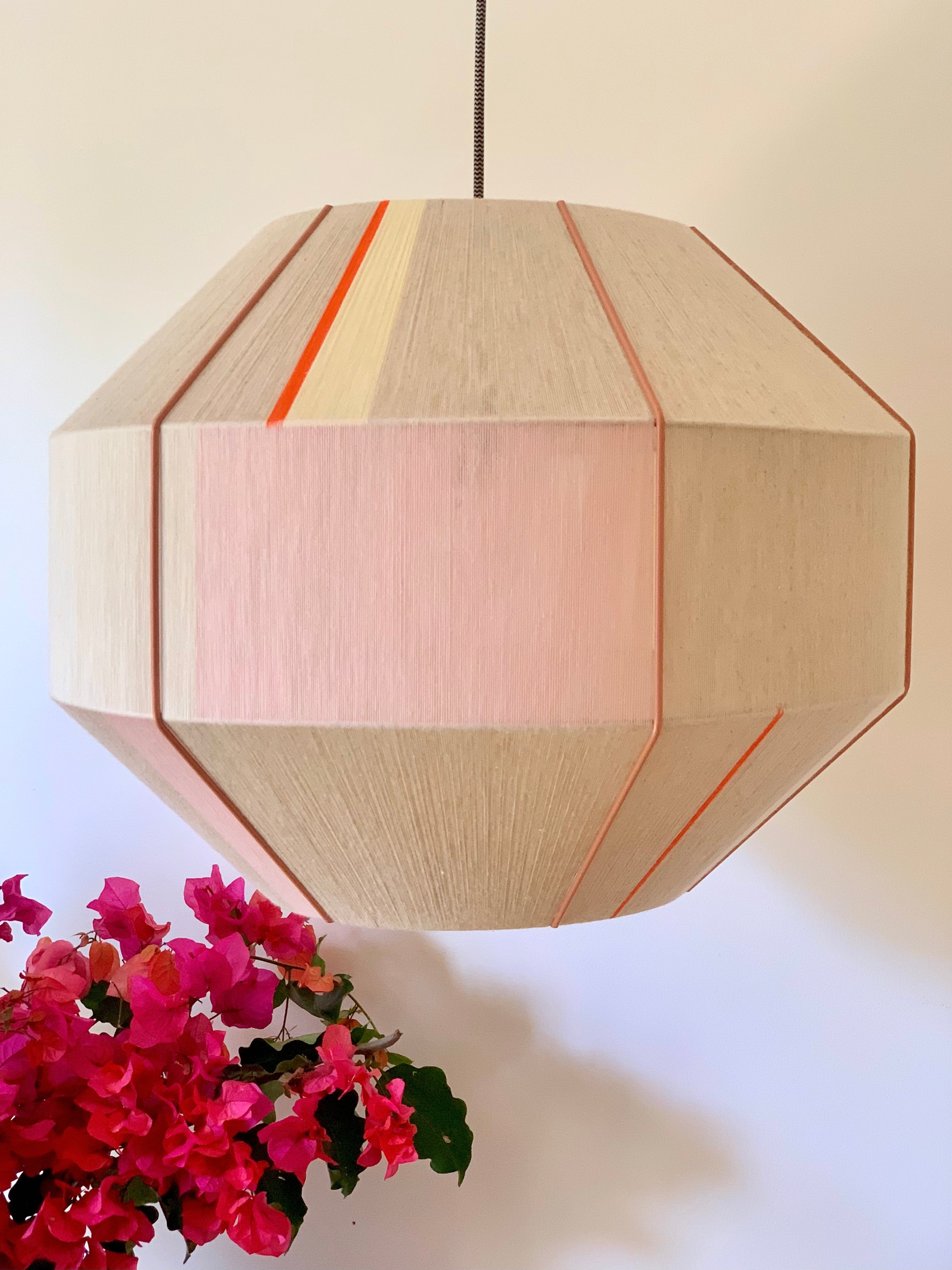 Amor Hive pendant light handwoven in blush, eucalyptus, lilac and natural yarns by Skye Lightly
