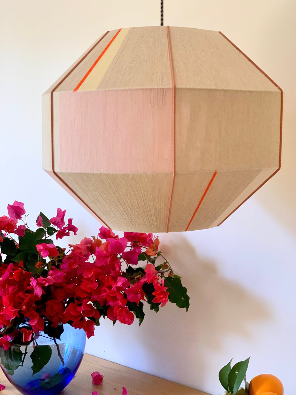 Amor Hive pendant light handwoven in blush, eucalyptus, lilac and natural yarns by Skye Lightly
