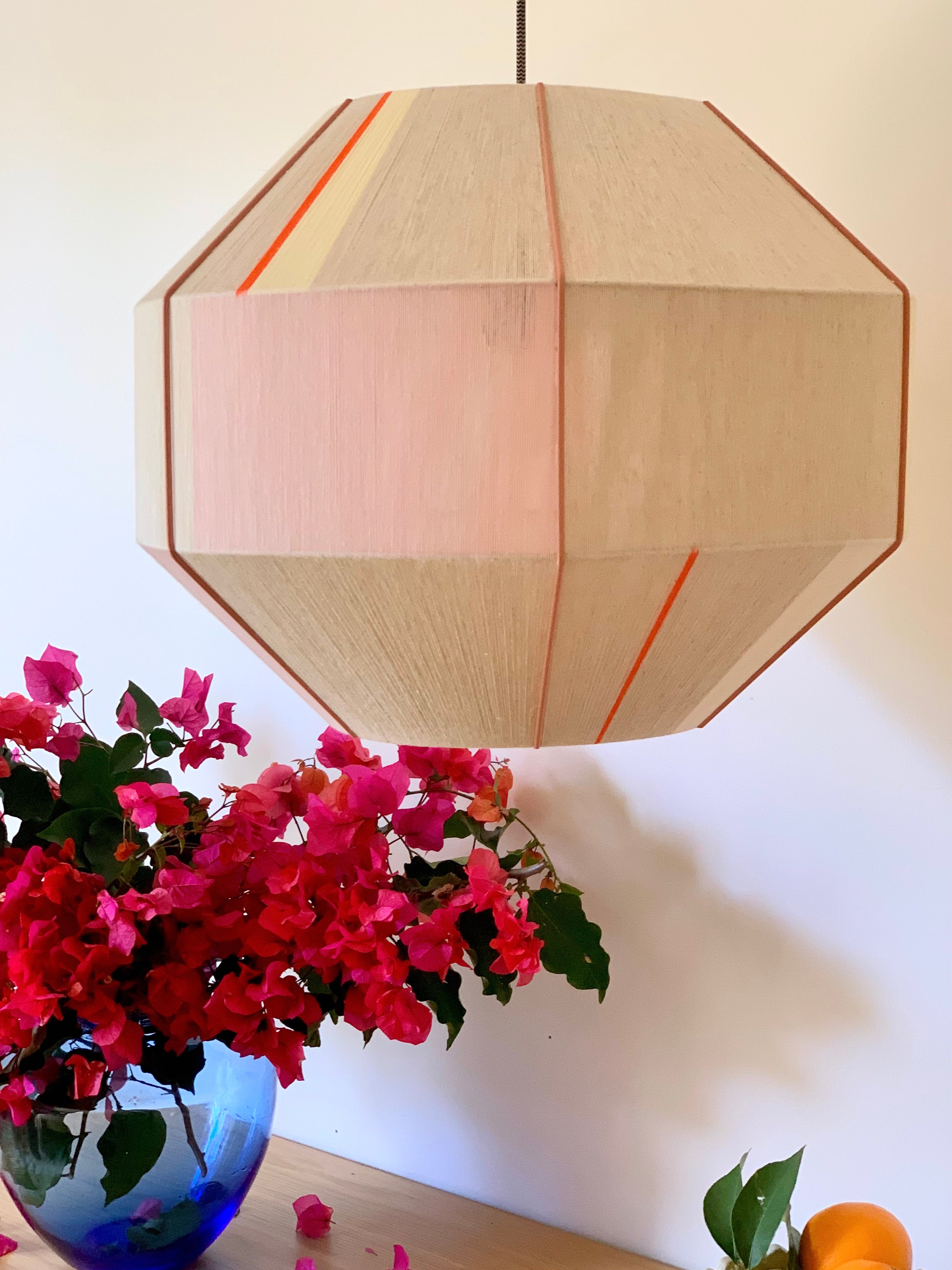 Amor Hive pendant light handwoven in blush, eucalyptus, lilac and natural yarns by Skye Lightly

