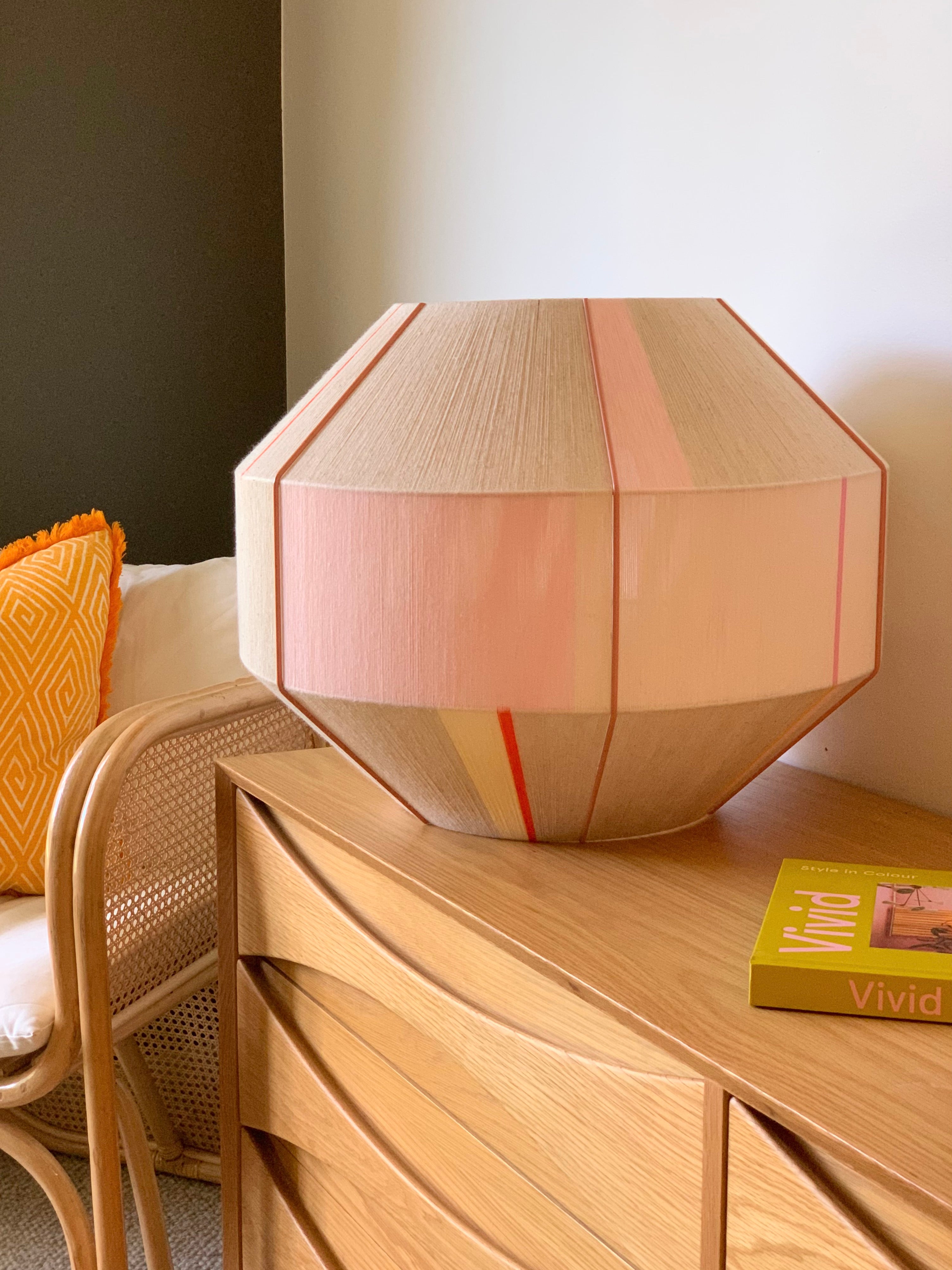 Amor Hive pendant light handwoven in blush, eucalyptus, lilac and natural yarns by Skye Lightly
