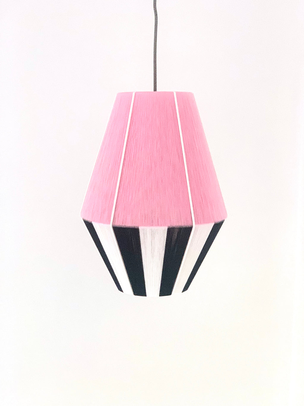 Centre of Liquorice Allsorts Baya shade handwoven in black, white and rose yarns by Skye Lightly