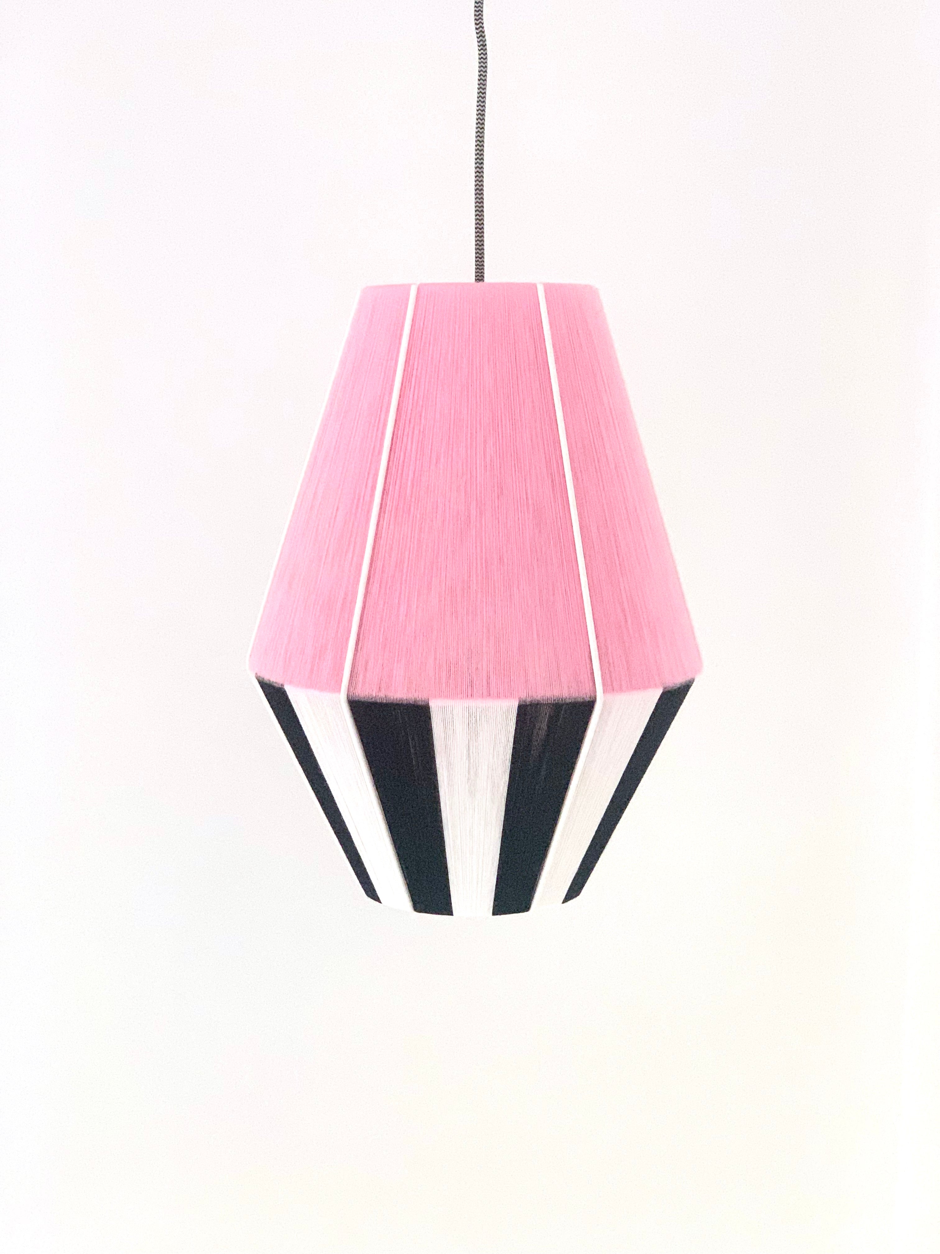 Centre of Liquorice Allsorts Baya shade handwoven in black, white and rose yarns by Skye Lightly