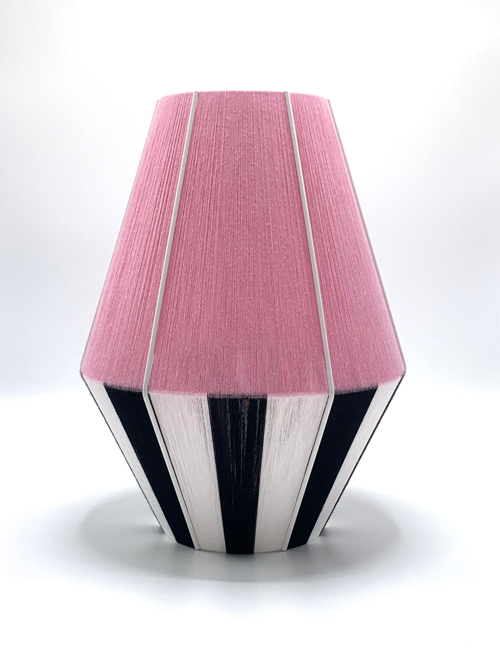 photoshoot of Liquorice Allsorts Baya shade handwoven in black, white and rose yarns by Skye Lightly