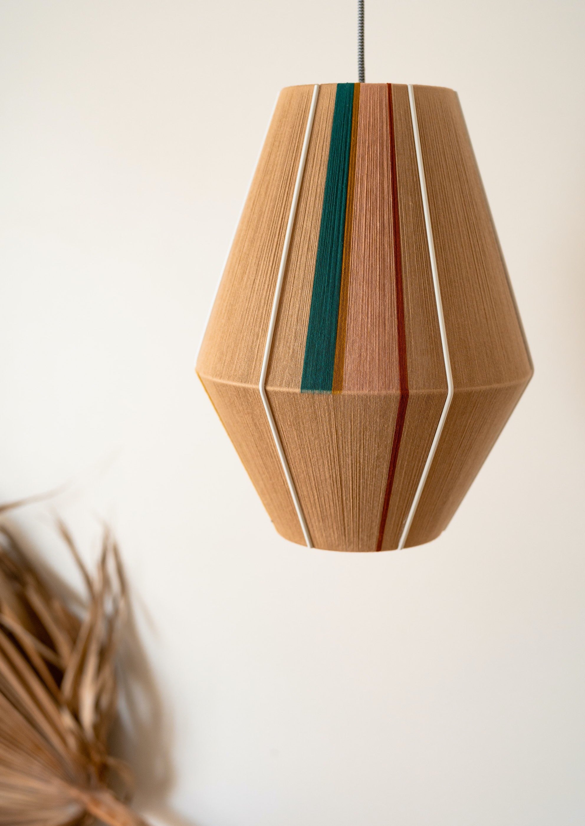 Casey Baya pendant light handwoven in periwinkle, blush, coral and natural yarns by Skye Lightly
