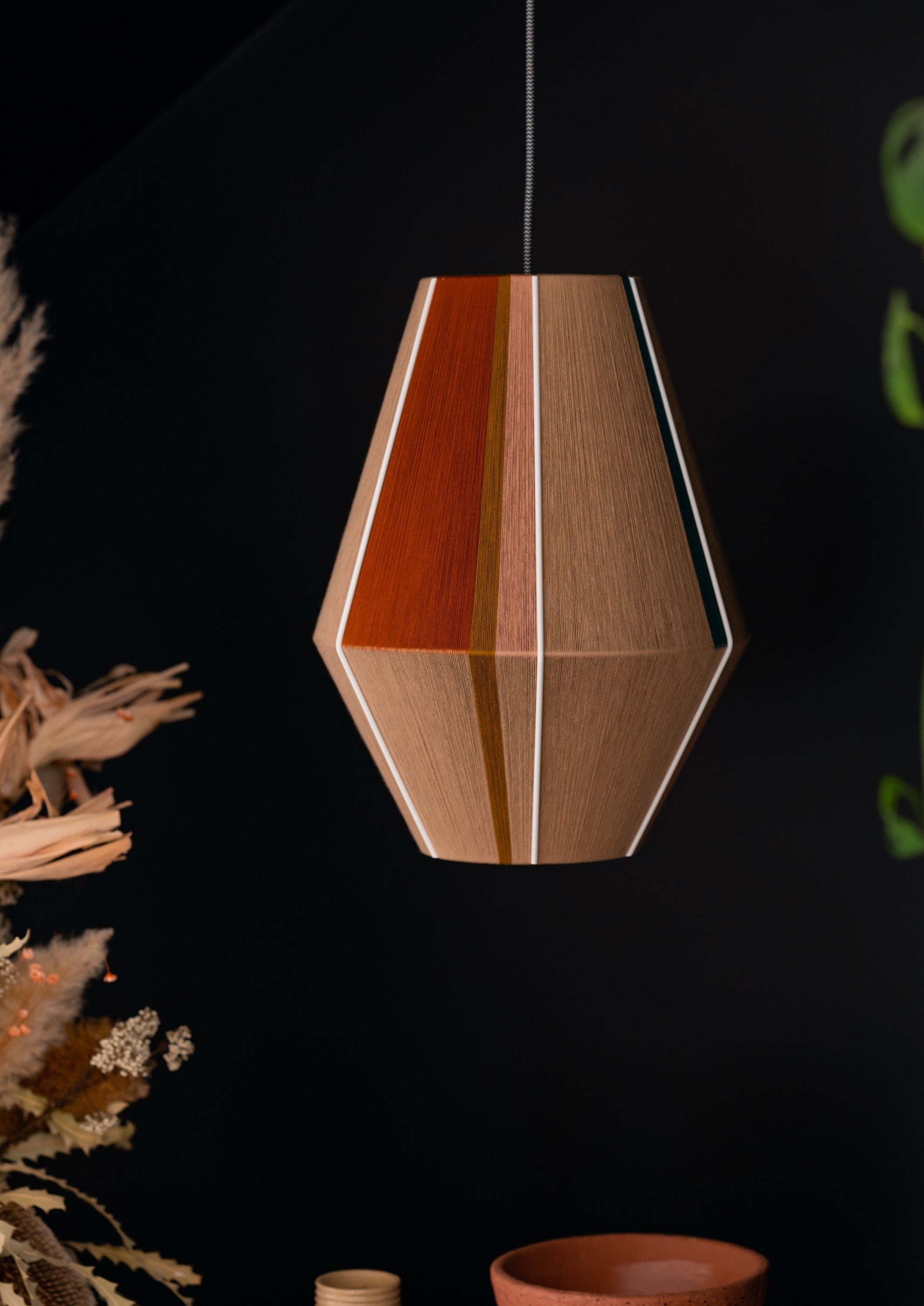 Casey Baya pendant light handwoven in periwinkle, blush, coral and natural yarns by Skye Lightly
