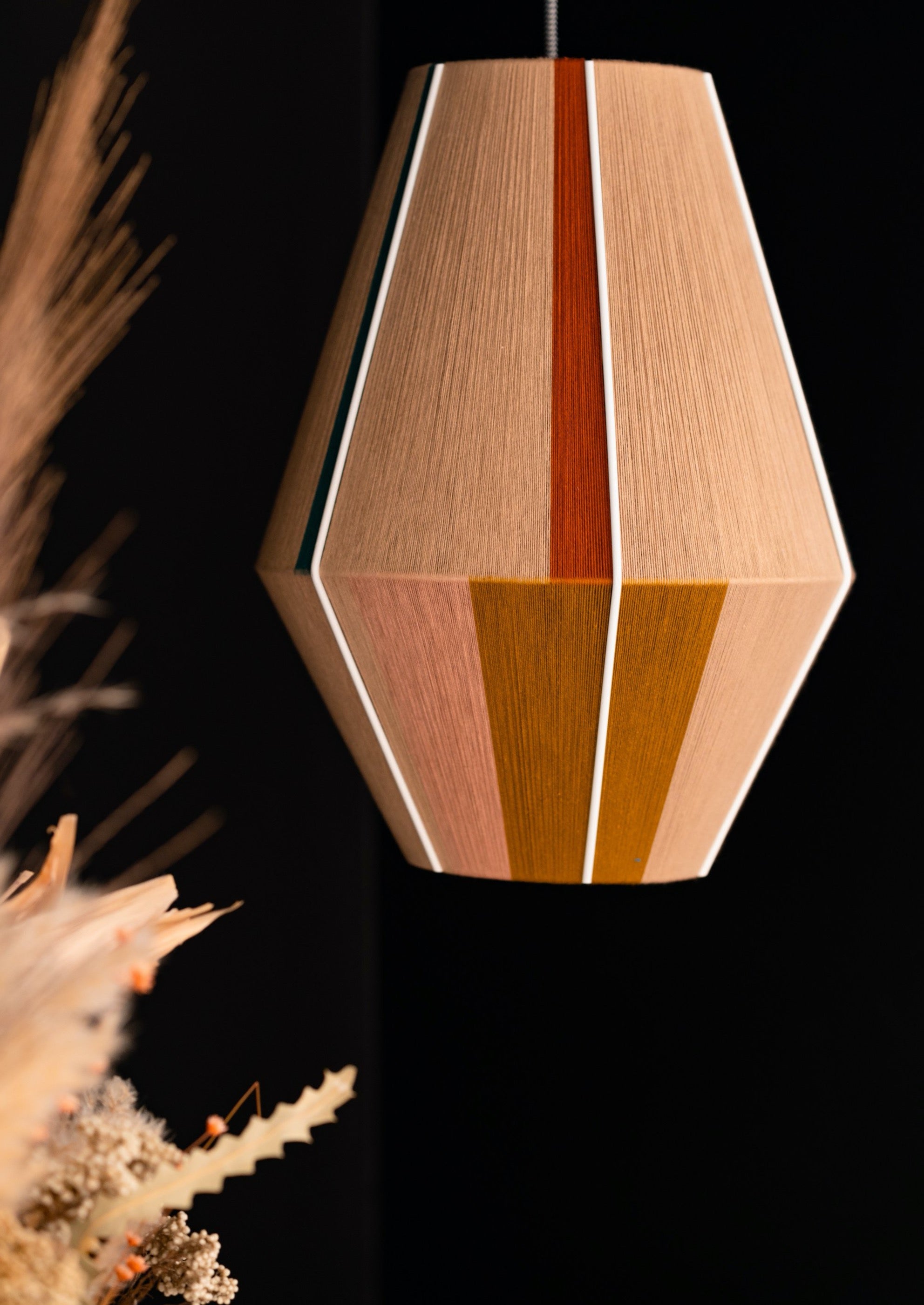 Casey Baya pendant light handwoven in periwinkle, blush, coral and natural yarns by Skye Lightly
