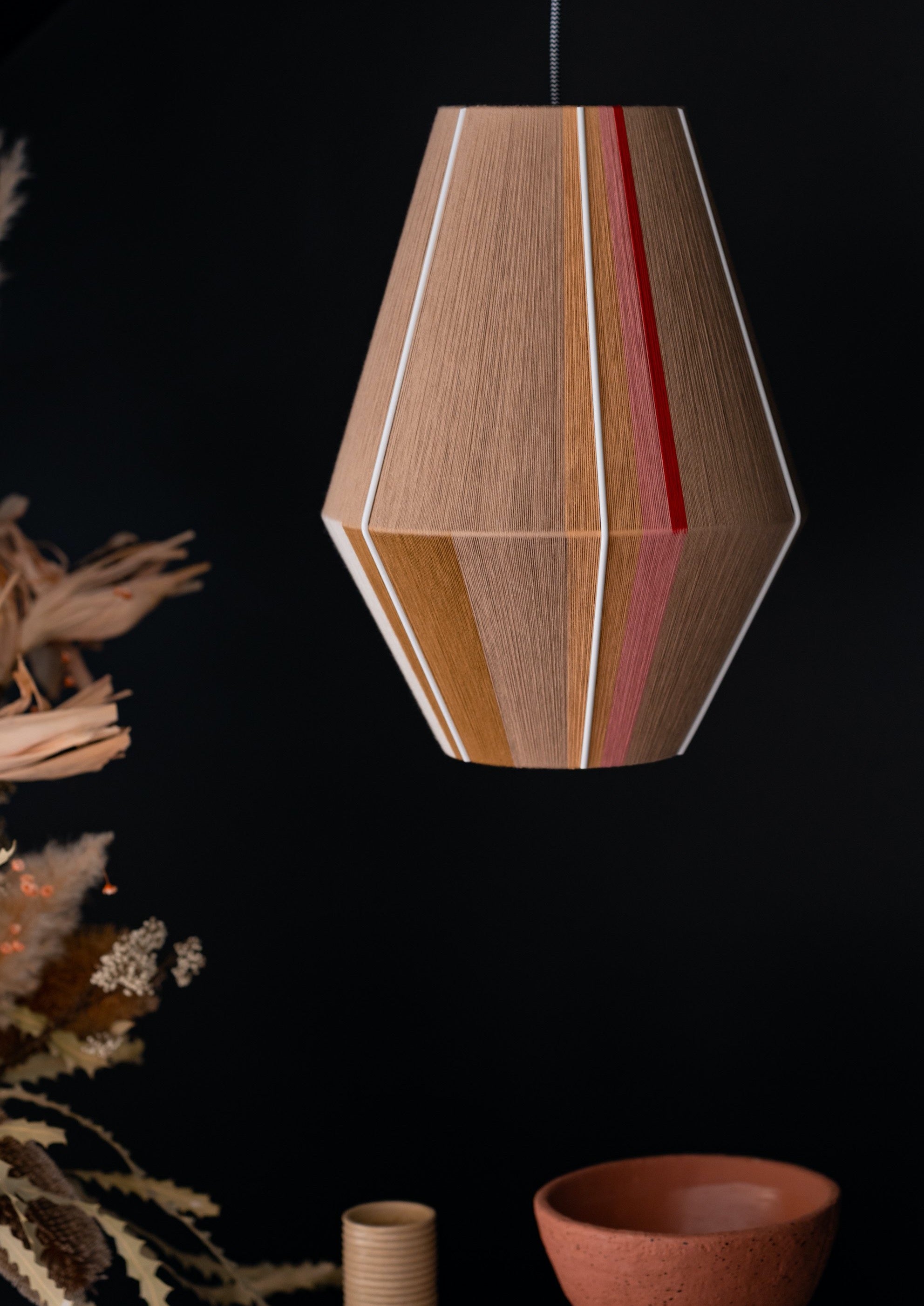 Catherine Baya pendant light handwoven in mustard, sage, peach and natural yarns by Skye Lightly
