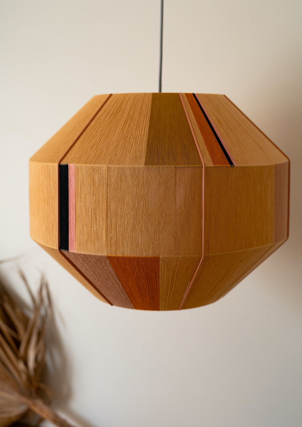 Charlotte Hive pendant light handwoven in sage, peach, periwinkle and natural yarns by Skye Lightly
