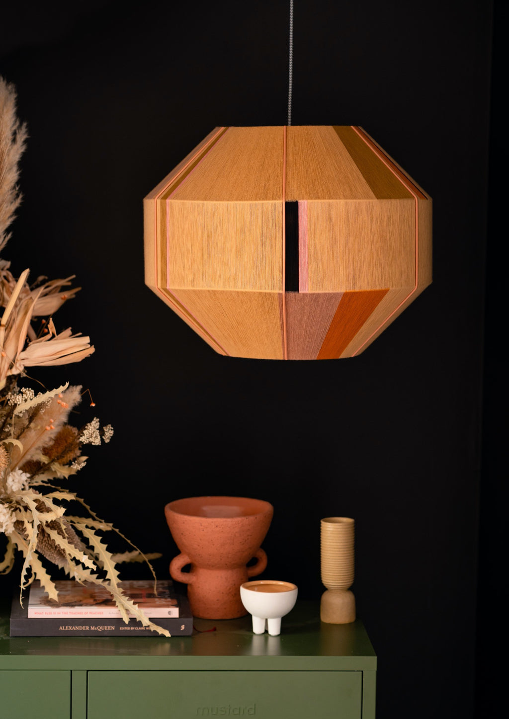 Charlotte Hive pendant light handwoven in sage, peach, periwinkle and natural yarns by Skye Lightly
