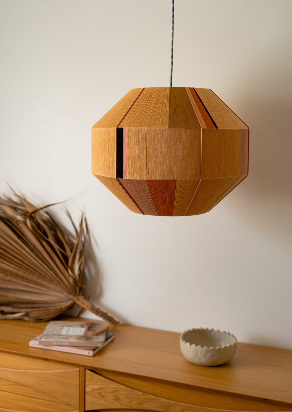 Charlotte Hive pendant light handwoven in sage, peach, periwinkle and natural yarns by Skye Lightly
