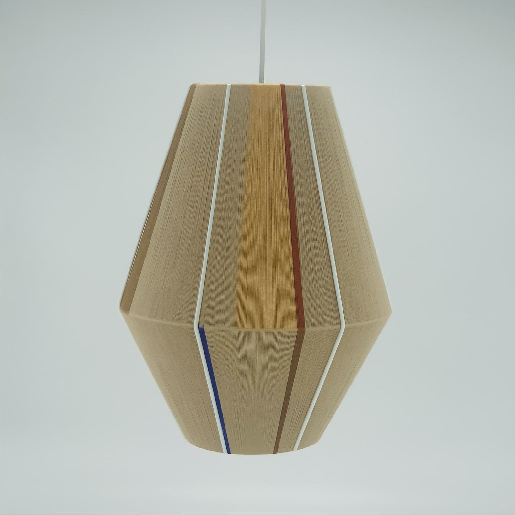 Julia Baya pendant light handwoven in rose, teal, apricot and natural yarns by Skye Lightly
