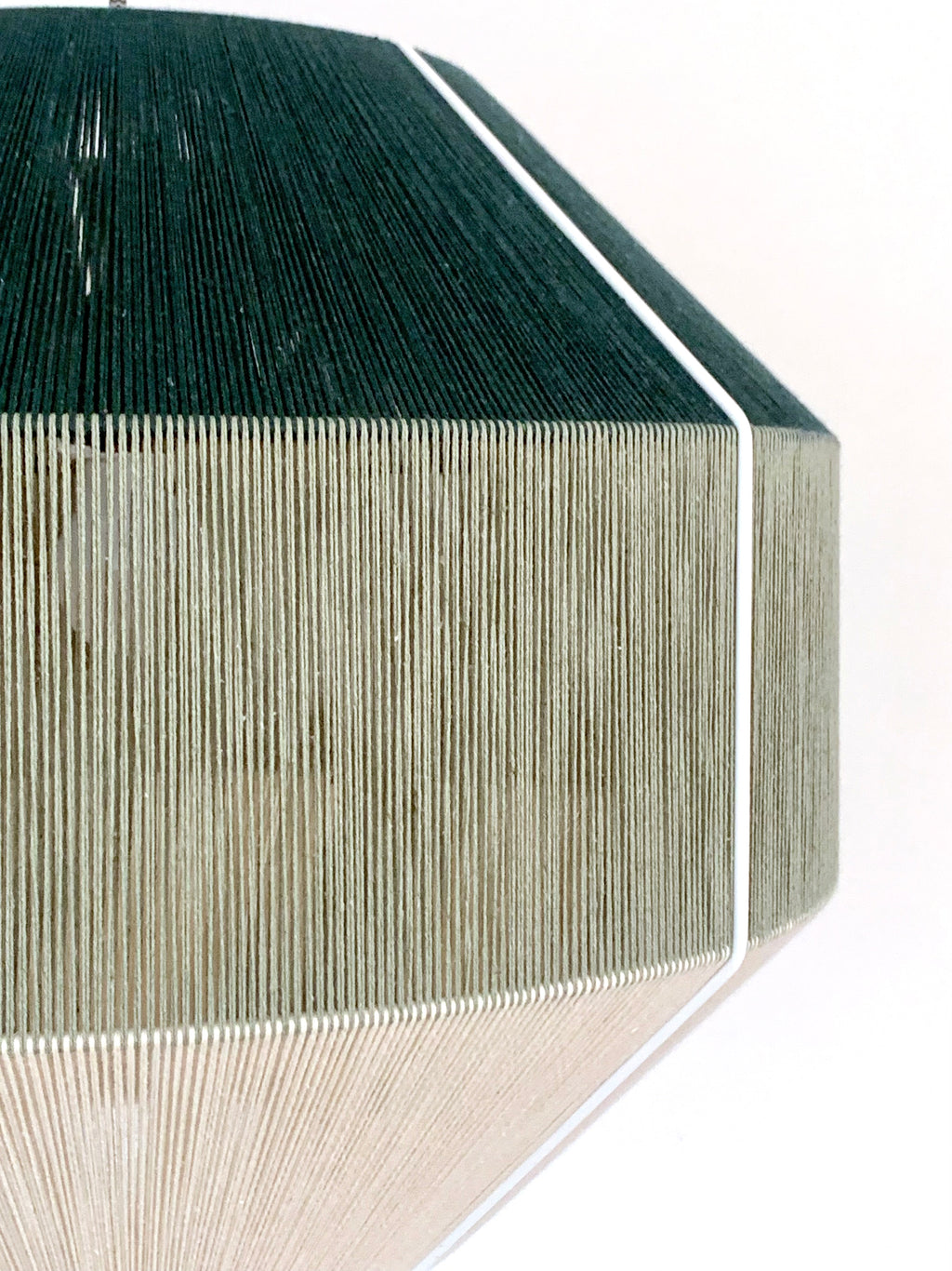 Closeup of Hive pendant light handwoven in Kentucky green and sage yarns by Skye Lightly