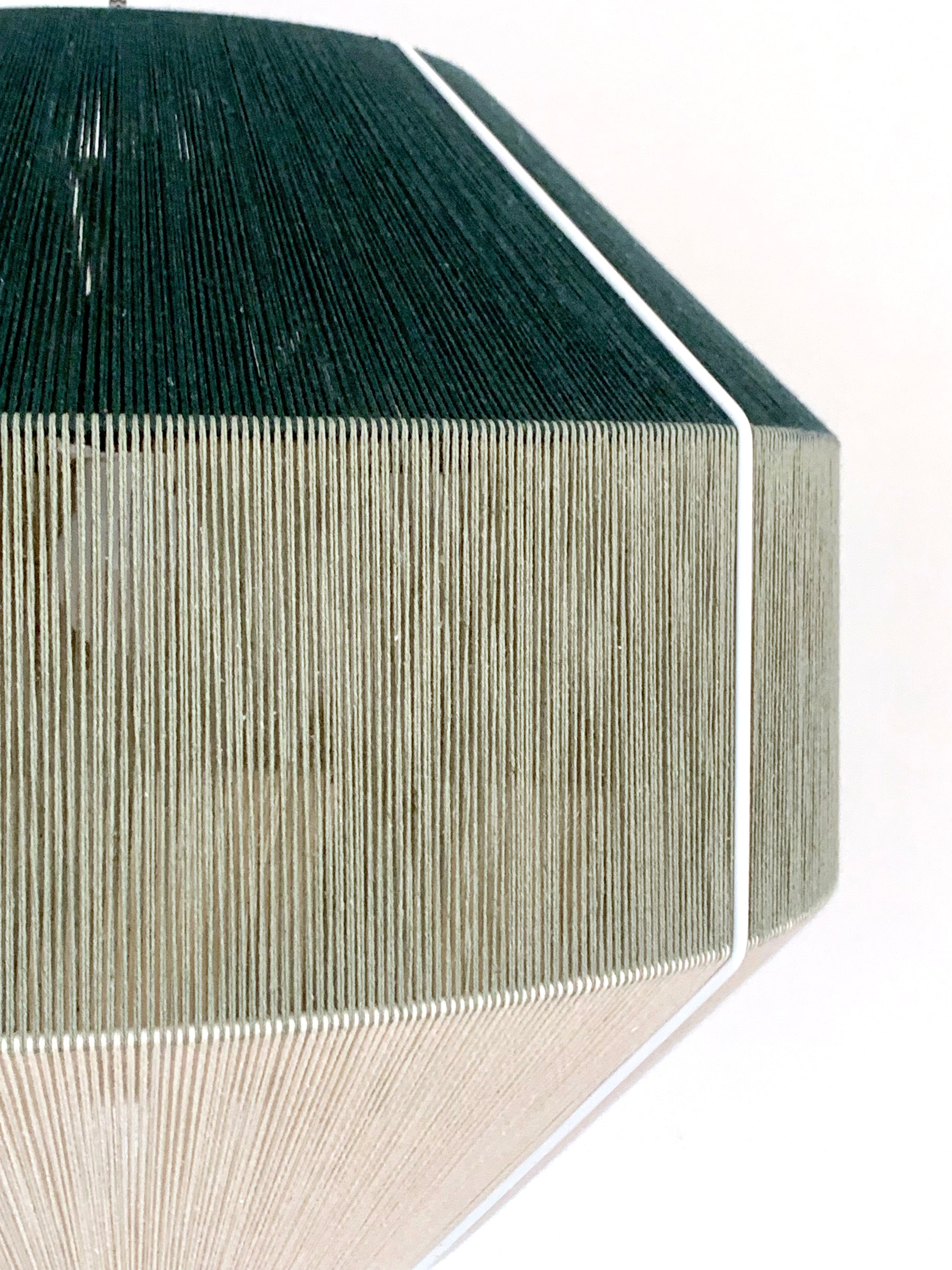 Closeup of Hive pendant light handwoven in Kentucky green and sage yarns by Skye Lightly