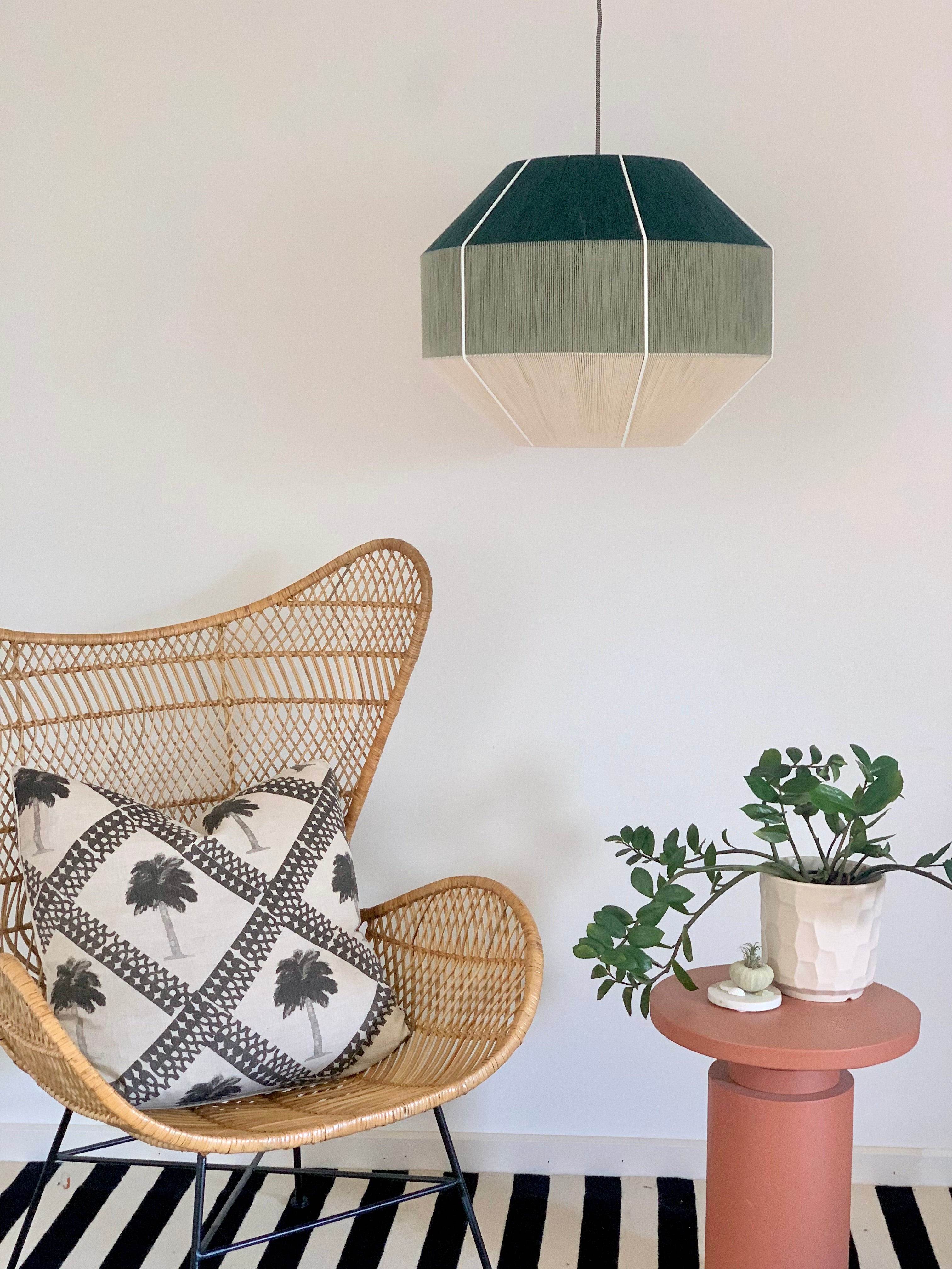 lifestyle photo of Hive pendant light handwoven in Kentucky green and sage yarns by Skye Lightly