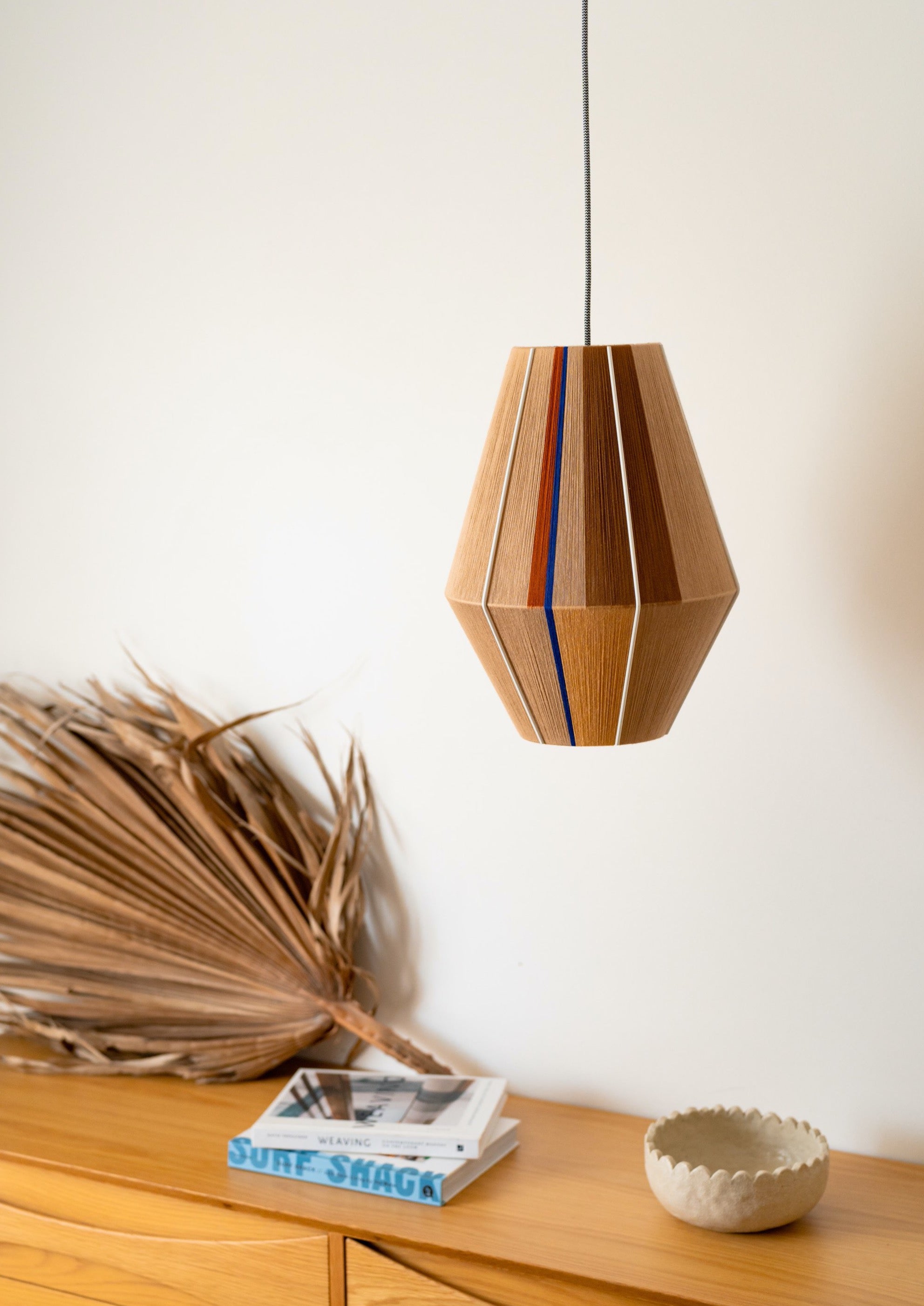 Julia Baya pendant light handwoven in rose, teal, apricot and natural yarns by Skye Lightly
