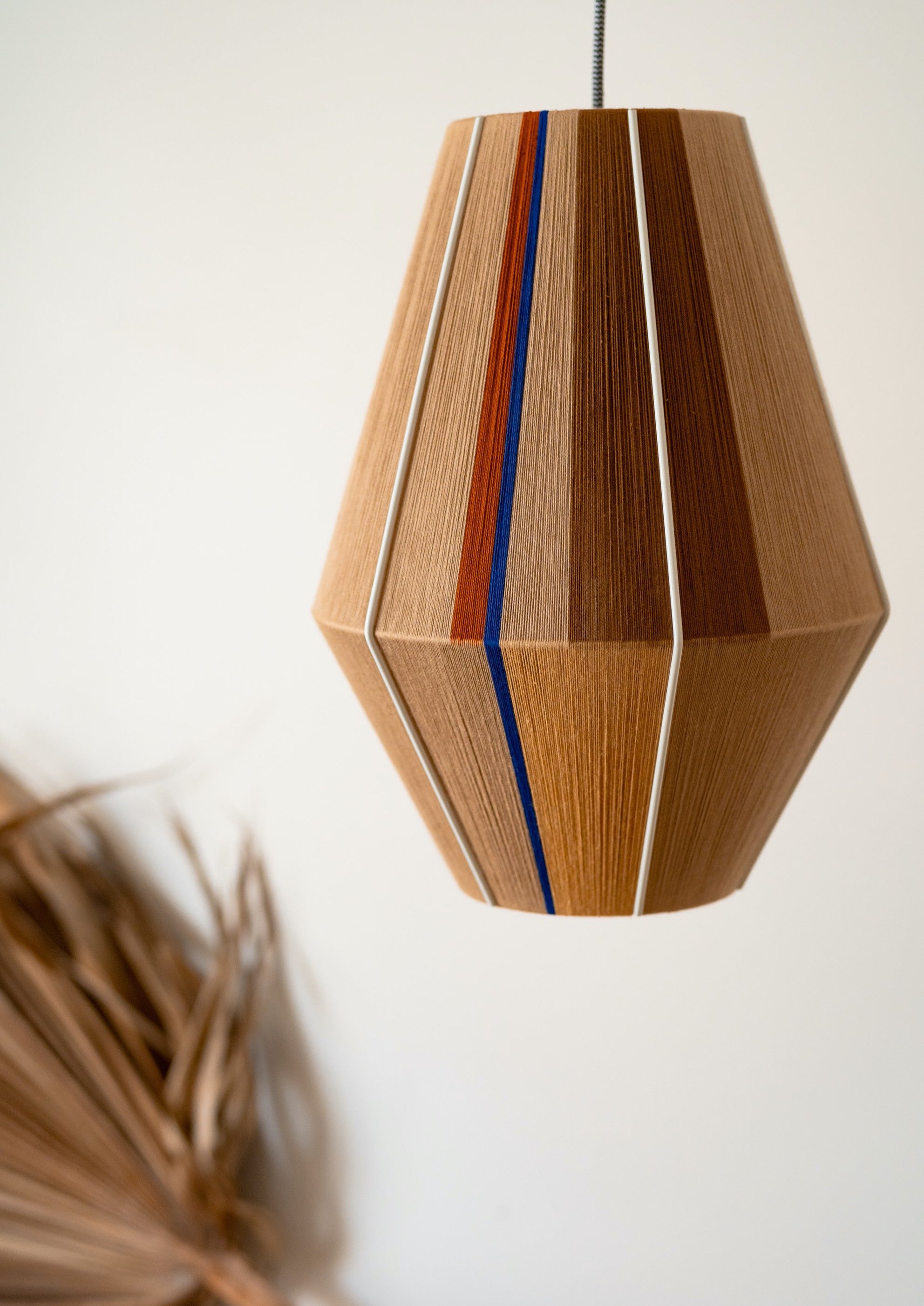 Julia Baya pendant light handwoven in rose, teal, apricot and natural yarns by Skye Lightly
