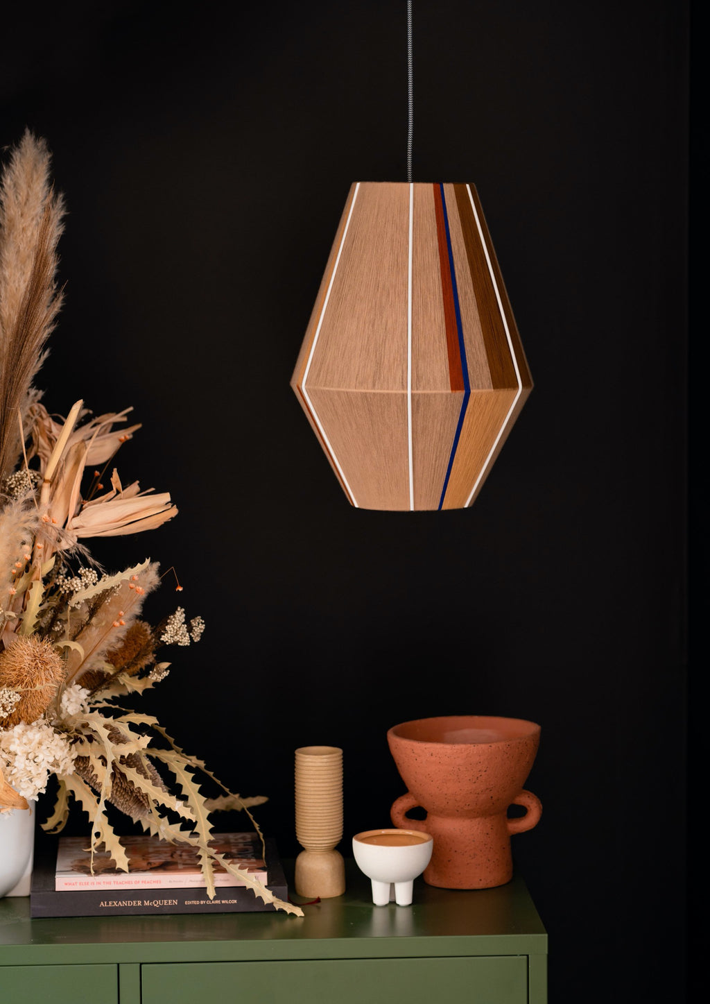 Julia Baya pendant light handwoven in rose, teal, apricot and natural yarns by Skye Lightly
