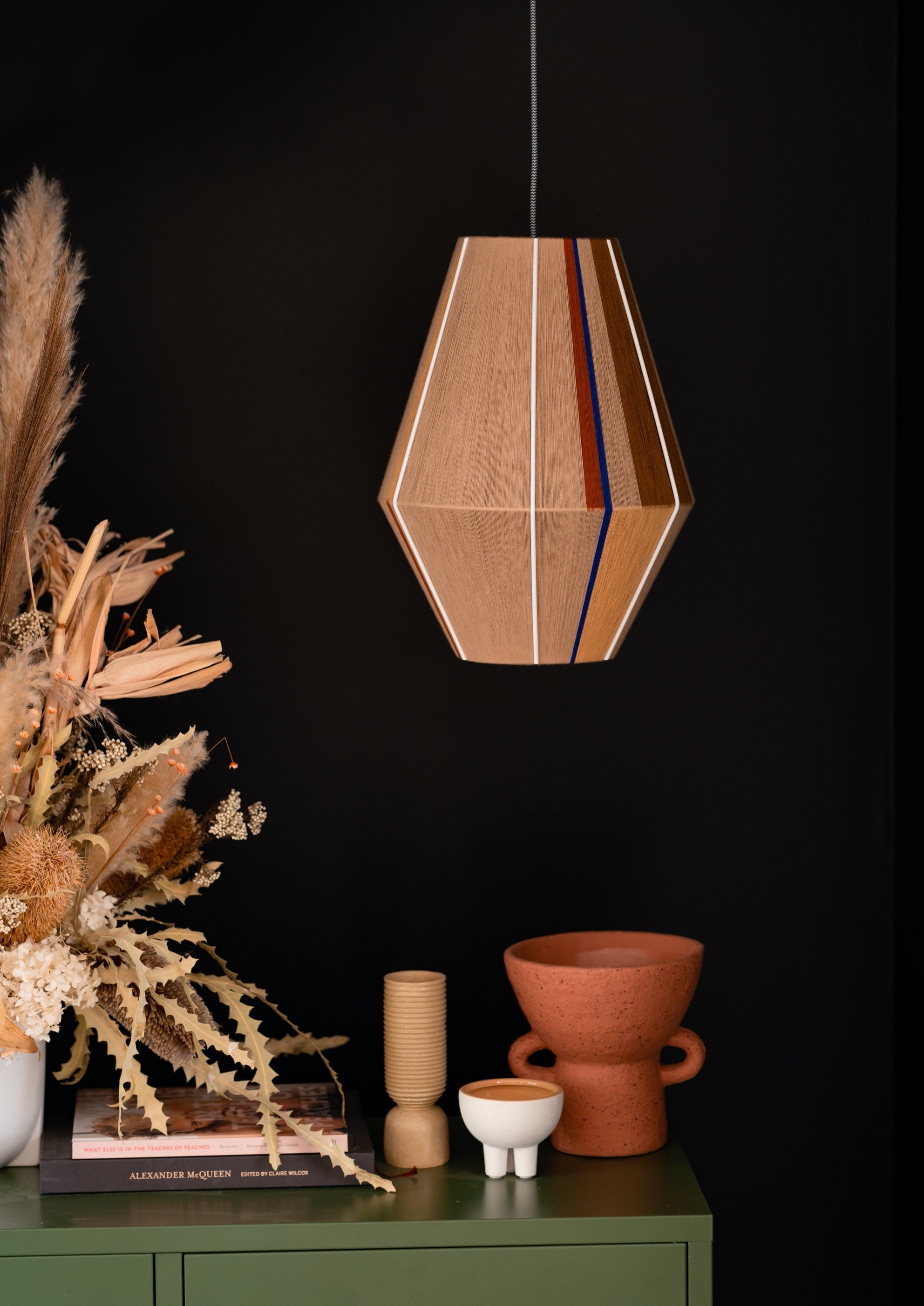 Julia Baya pendant light handwoven in rose, teal, apricot and natural yarns by Skye Lightly
