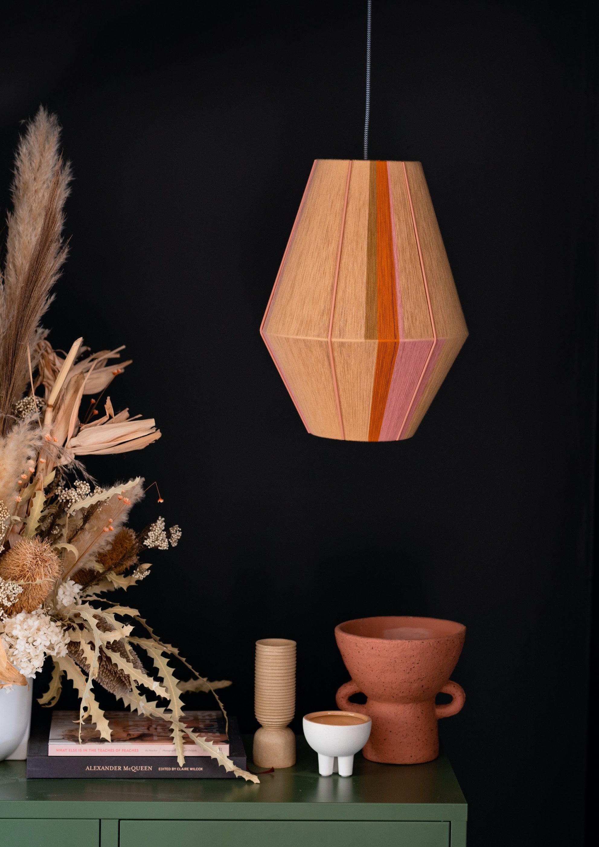 Keaton Baya pendant light handwoven in navy, mustard, coral and natural yarns by Skye Lightly
