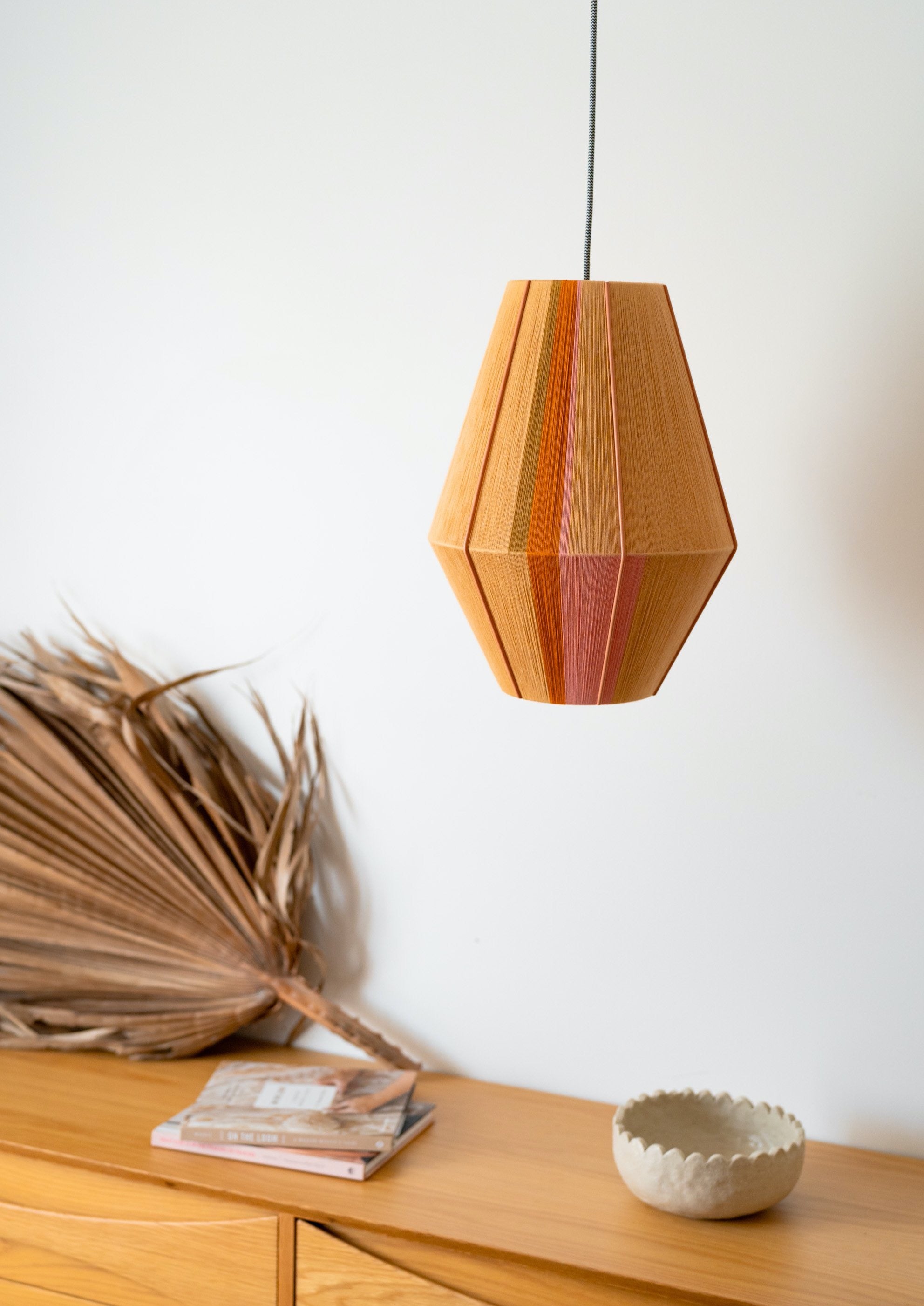 Keaton Baya pendant light handwoven in navy, mustard, coral and natural yarns by Skye Lightly
