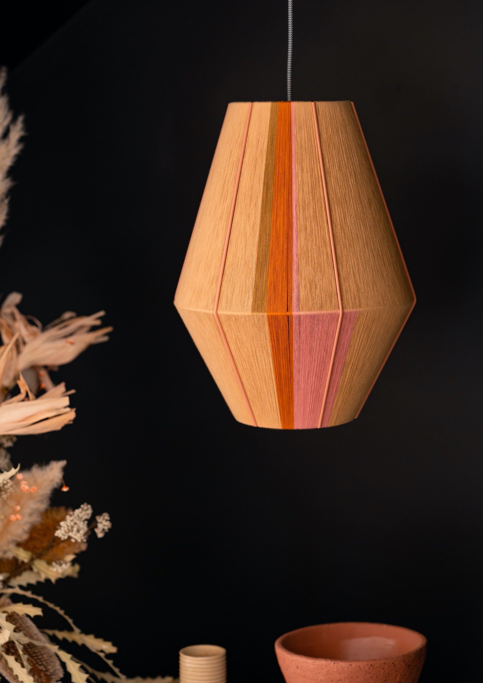 Keaton Baya pendant light handwoven in navy, mustard, coral and natural yarns by Skye Lightly

