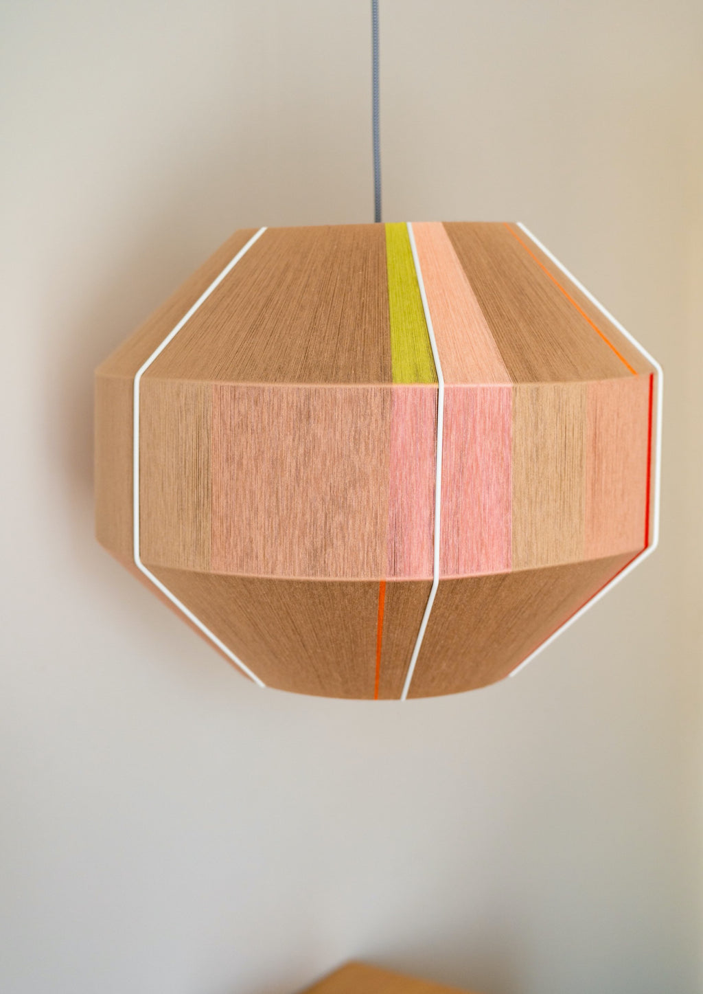 Laura Hive pendant light handwoven in blush, lilac, mustard and natural yarns by Skye Lightly
