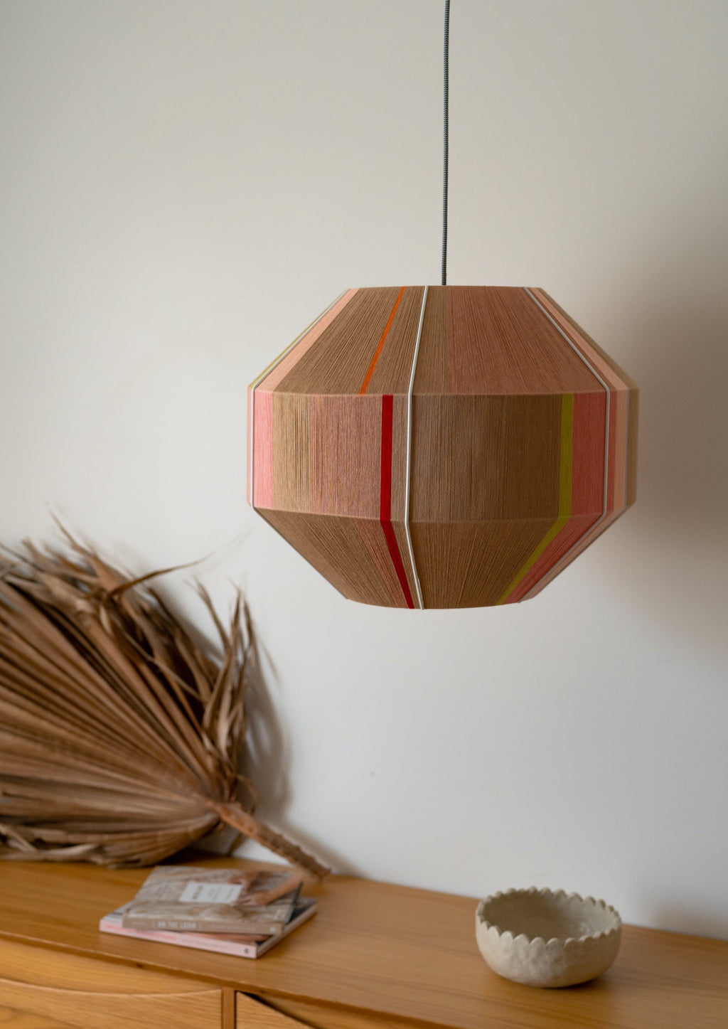 Laura Hive pendant light handwoven in blush, lilac, mustard and natural yarns by Skye Lightly
