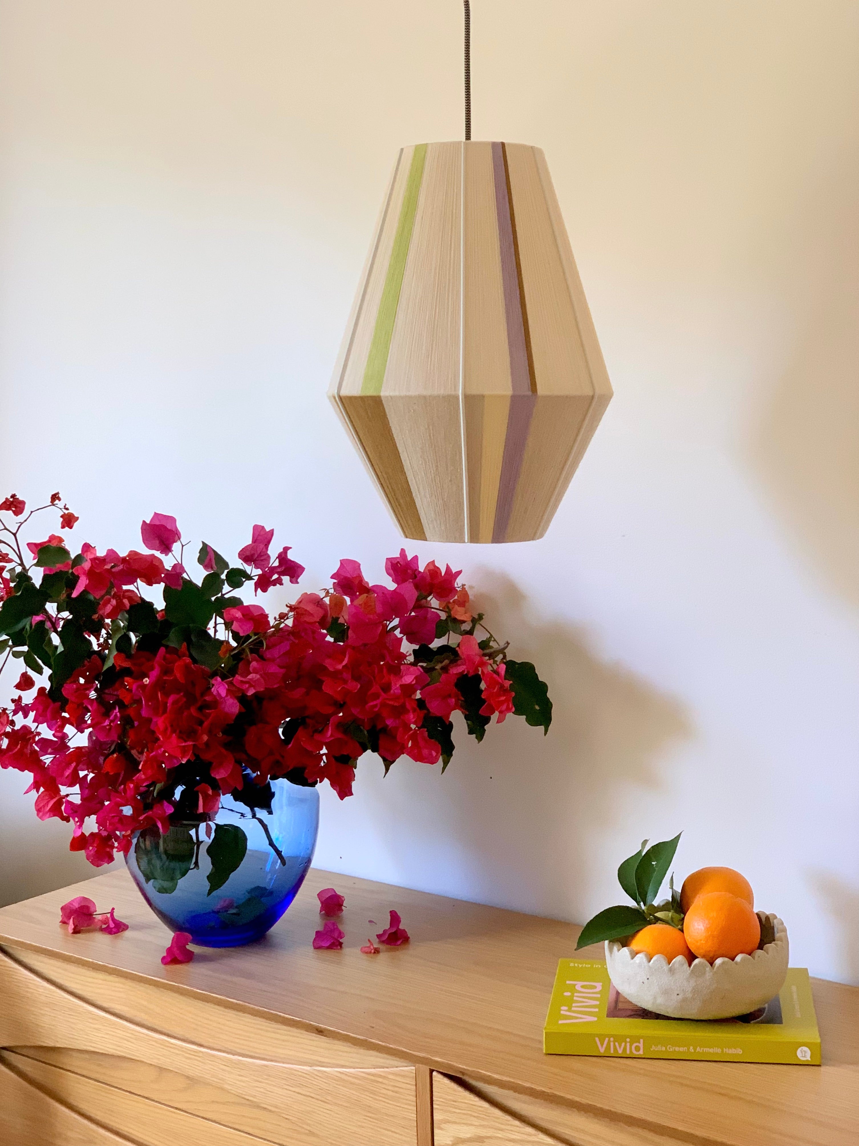 image of Lou Lou Baya pendant light handwoven in teal, peach, lavender, and natural yarns by Skye Lightly