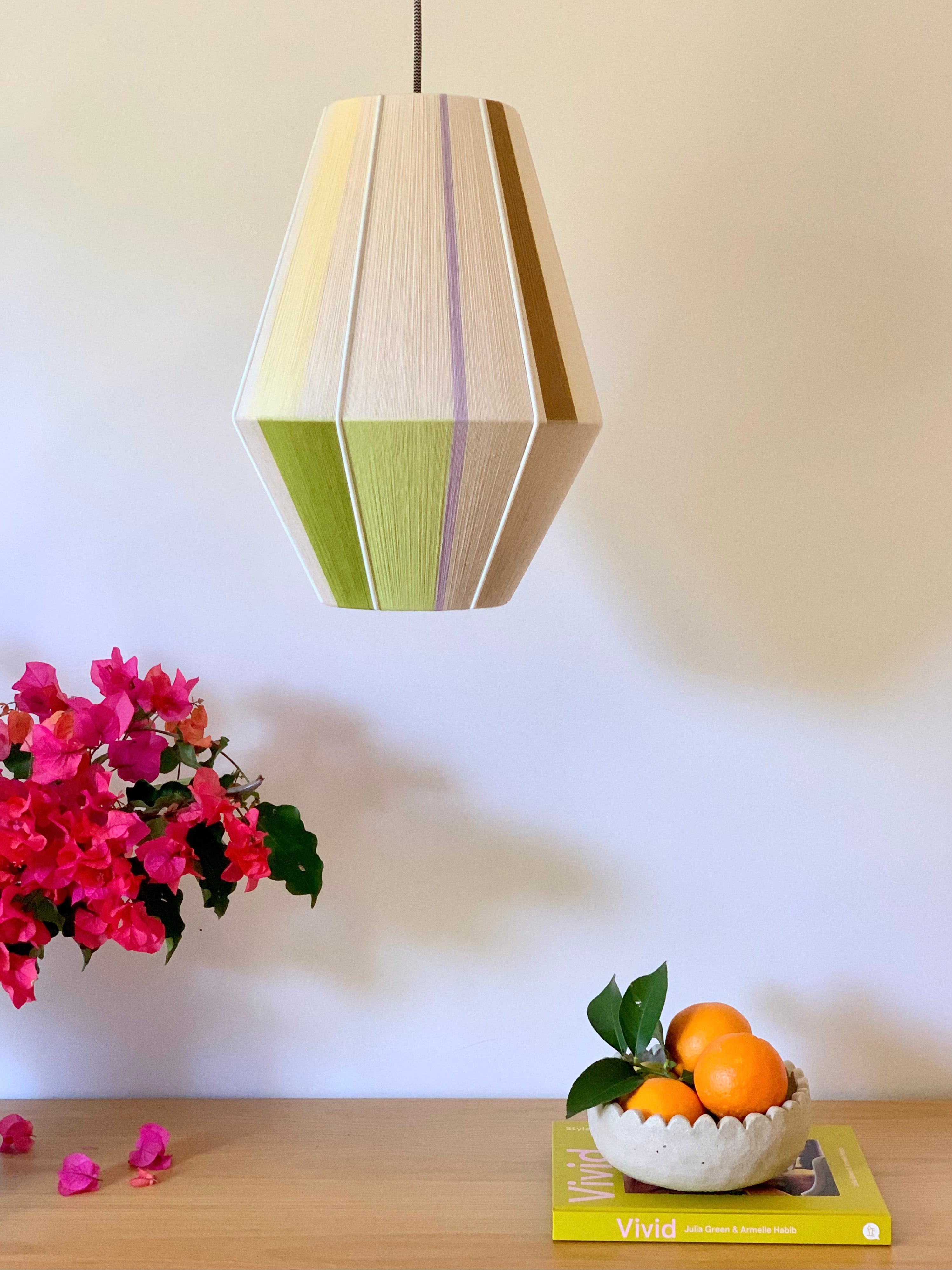 Lou Lou Baya pendant light handwoven in teal, peach, lavender, and natural yarns by Skye Lightly