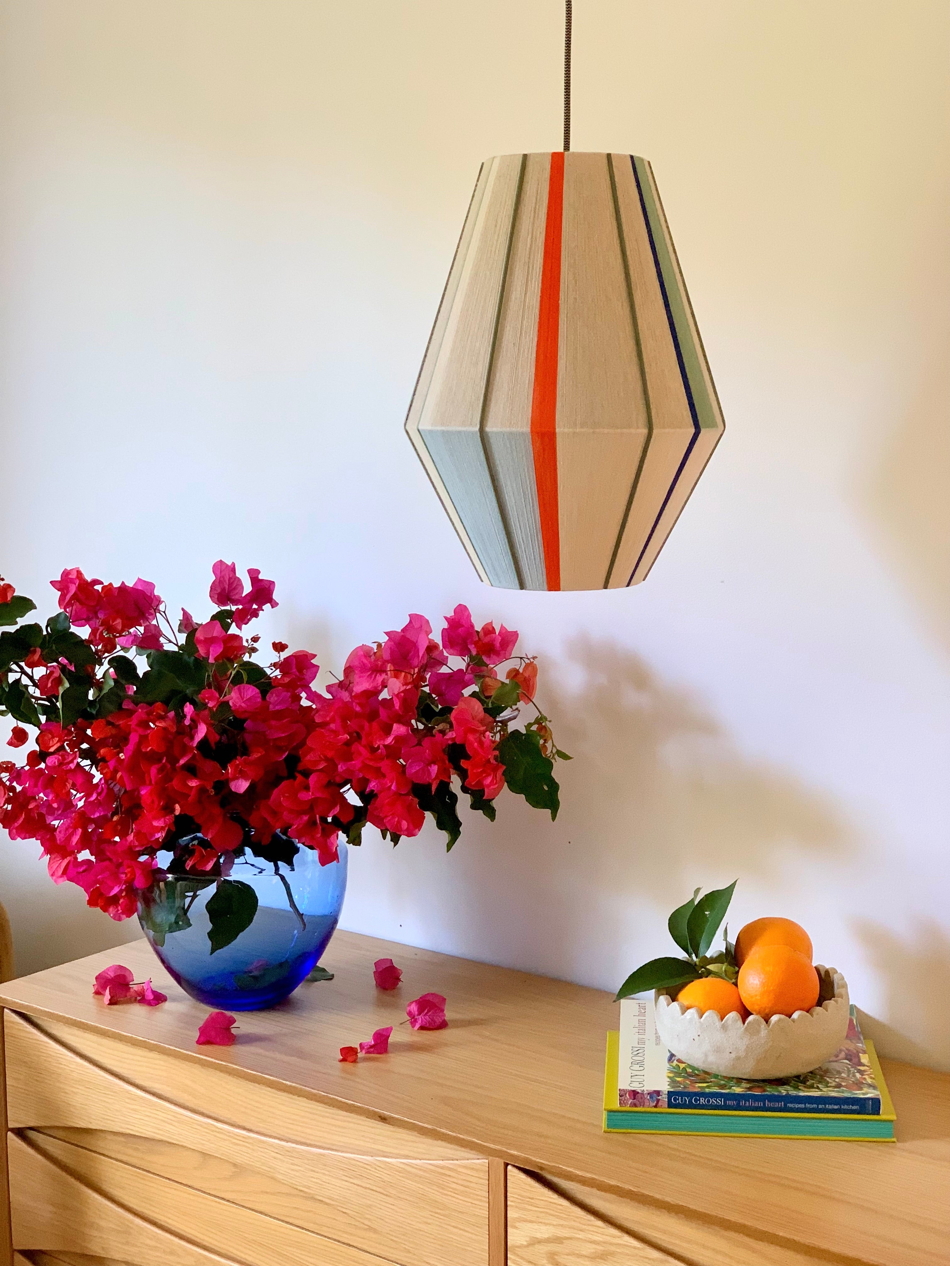 Luca Baya pendant light handwoven in navy, mustard, lilac, and natural yarns by Skye Lightly
